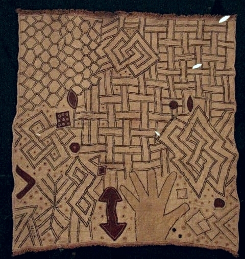 Panel (ncák) ; Kuba peoples, Democratic Republic of the Congo. 20th century; raffia, embroidery, appliqué; 23-1/4 x 24-3/4 (59 c 63 cm). Musée Royal de L'Afrique Centrale, Tervuren. Gift of R.G. de Notre-Dame de Fichermont, October 21, 1949