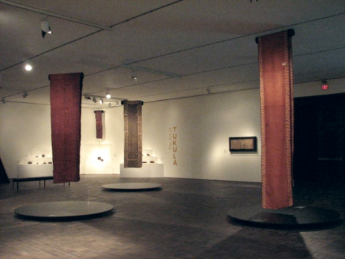  The cloths in the foreground are the art of t ukula and ngula, a red dye used on textiles and as a personal cosmetic.