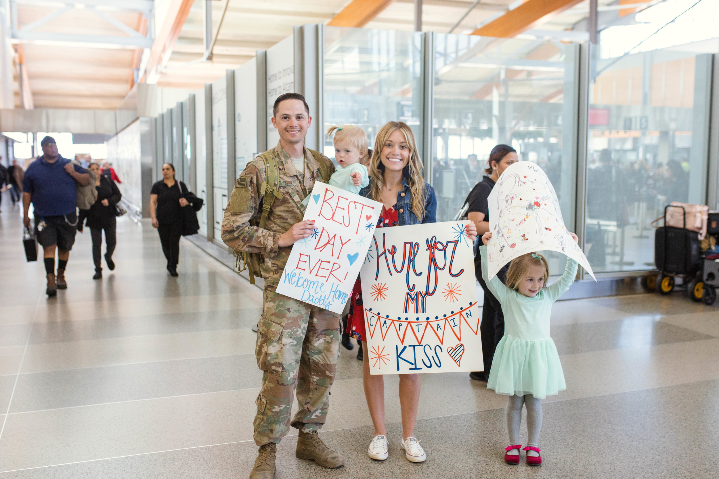 Kiss - Military Homecoming Photographer at Raleigh-Durham International Airport 