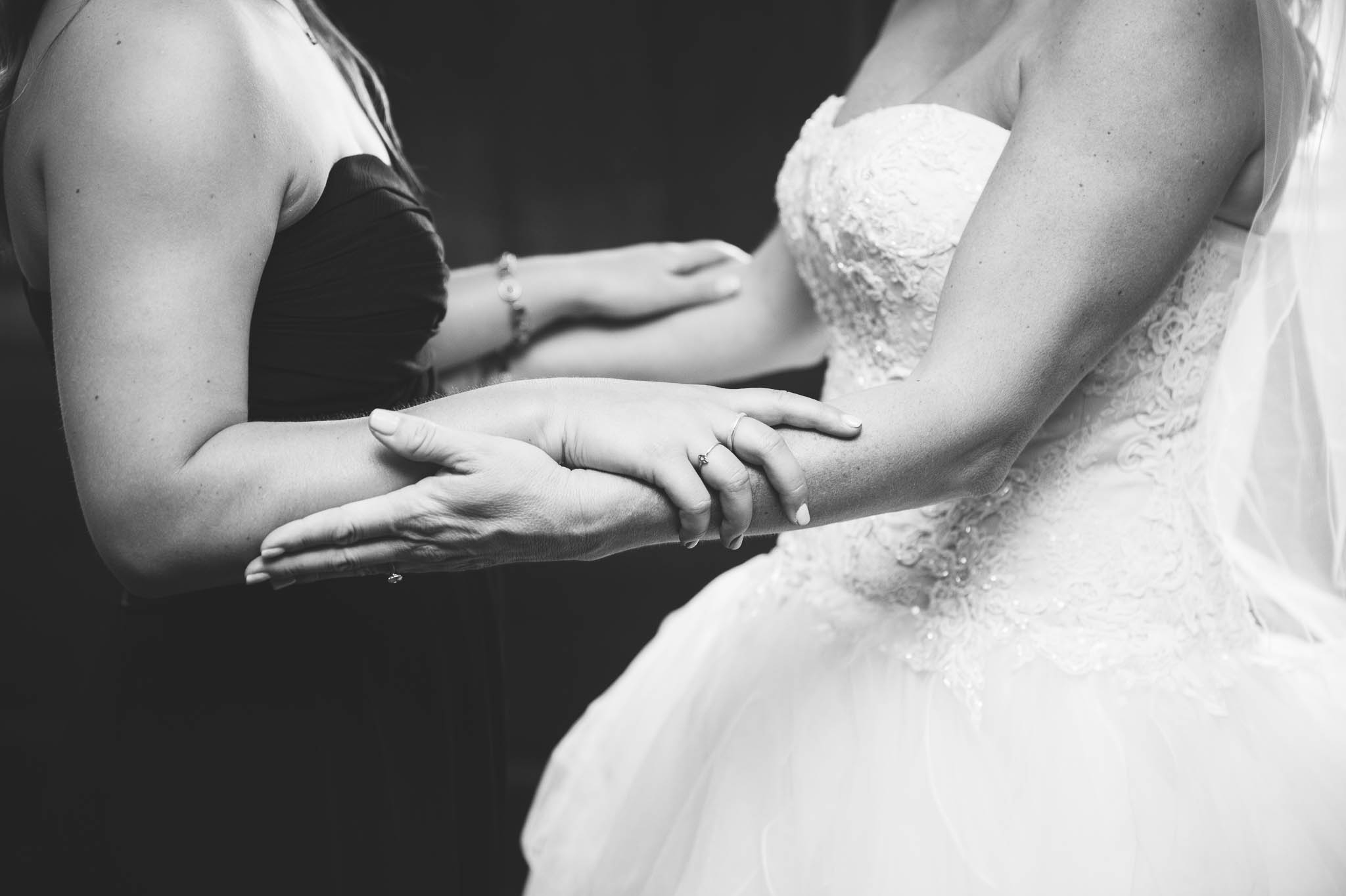 Bride and her daughter holding hands before the wedding - Dona + Doug - MacGregor Downs Country Club in Cary, NC - Raleigh Wedding Photographer