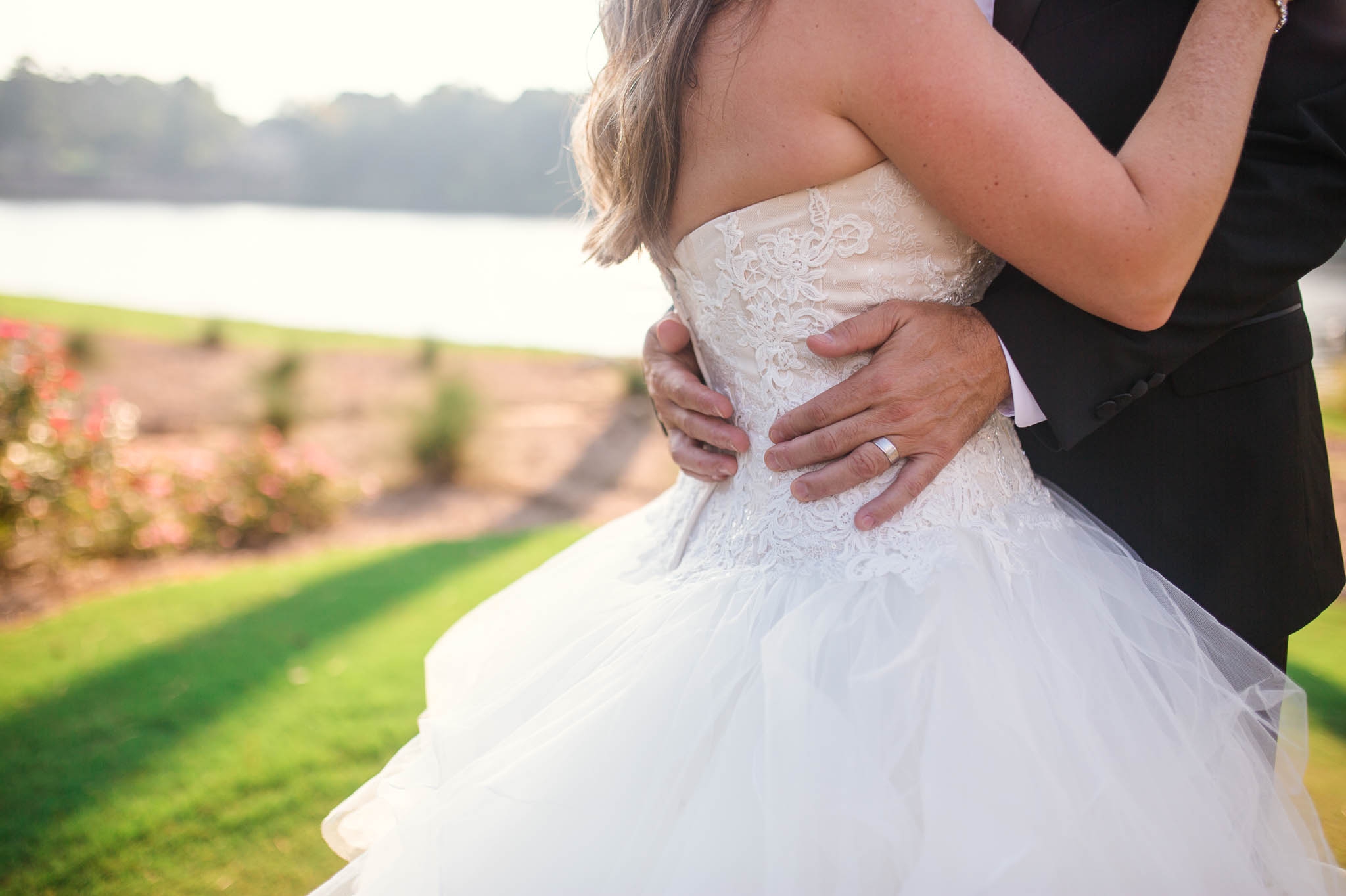 Bride and Groom hugging = Dona + Doug - MacGregor Downs Country Club in Cary, NC - Raleigh Wedding Photographer