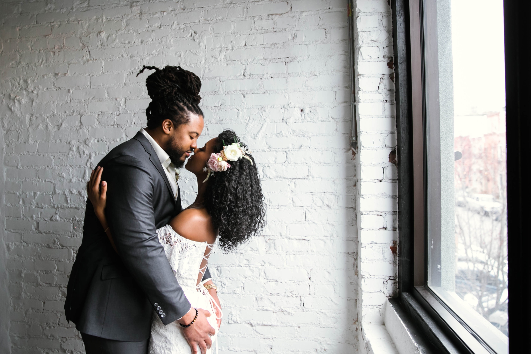 Indoor Wedding Portrait with natural light by a Window of an African American Black couple - boho tropical wedding inspiration by Honolulu, Oahu, Hawaii Photographer