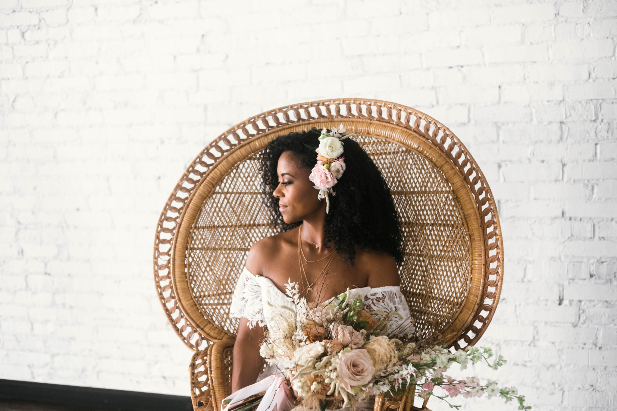  Indoor Wedding Portraits, shot with natural light - black love - african american bride sitting in a Midcentury Woven Wicker Peacock Chair in a boho wedding dress with a big bouquet - tropical inspiration - honolulu, oahu, hawaii photographer 
