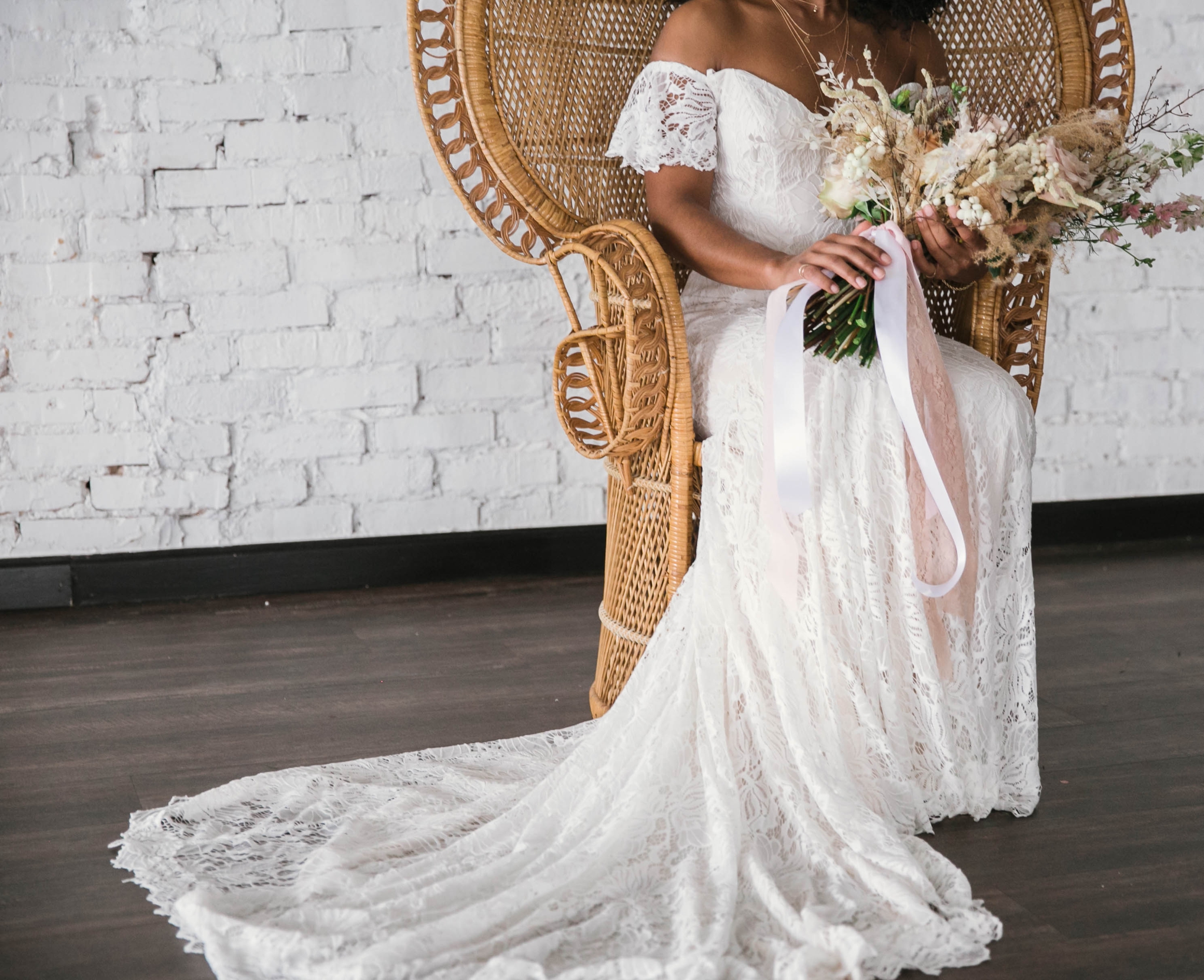  Indoor Wedding Portraits, shot with natural light - black love - african american bride sitting in a Midcentury Woven Wicker Peacock Chair in a boho wedding dress with a big bouquet - tropical inspiration - honolulu, oahu, hawaii photographer 