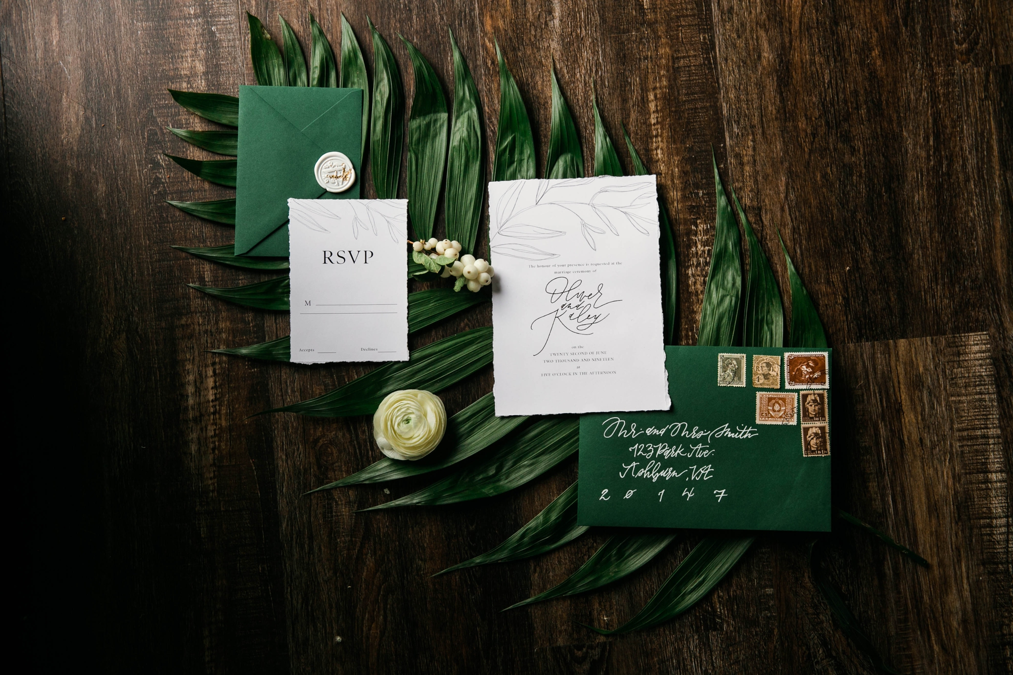  Lay flat of Wedding Invitation Suite with a tropical leave as the background styled by Johanna Dye Photography designed by Tortoise.Design - Oahu Hawaii Wedding Photographer  