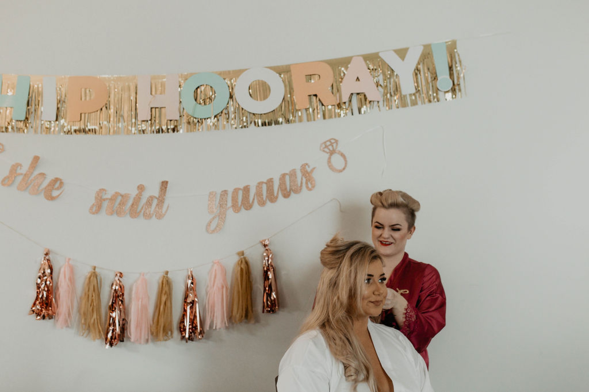 Bride getting her hair done with fun decorations in the background - Matt Smarsh and Johanna Dye - Raleigh North Carolina Urban Edgy Downtown Wedding