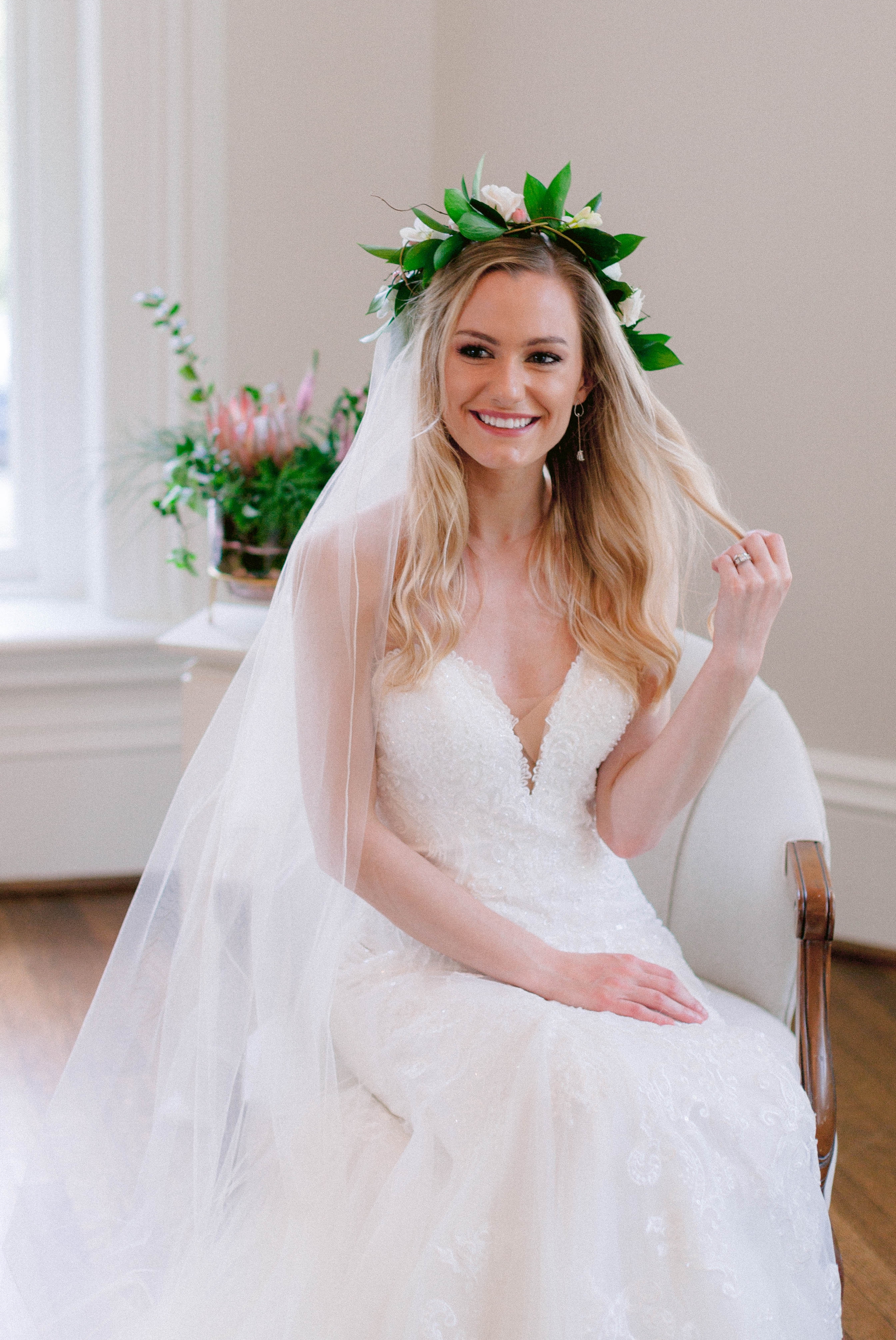  Indoor Bride + bridesmaids portraits in an all white room at a luxury estate with natural light before the ceremony - Bride is wearing a Hawaiian Flower Crown and a cathedral veil in a Wedding Gown by Stella York - Honolulu Oahu Hawaii Wedding Photo