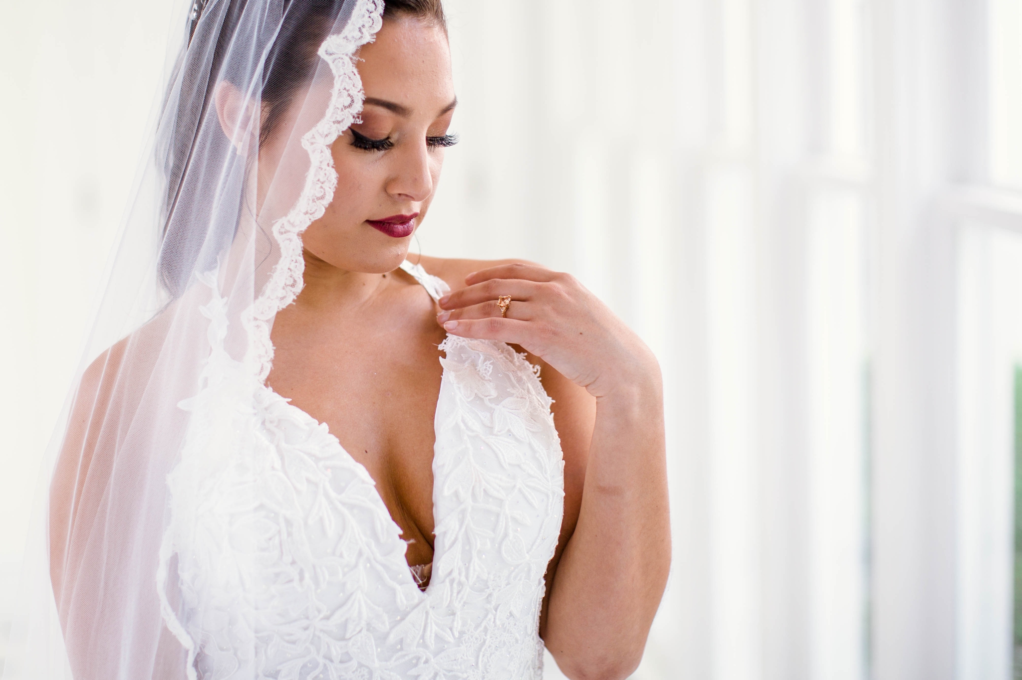 Natural light Bridal Portraits in an all white luxury estate venue with black and white floors and a golden chandelier - Bride is wearing a Ballgown Wedding Dress by Sherri Hill - shot with available window light - Fine Art Wedding Photographer in H
