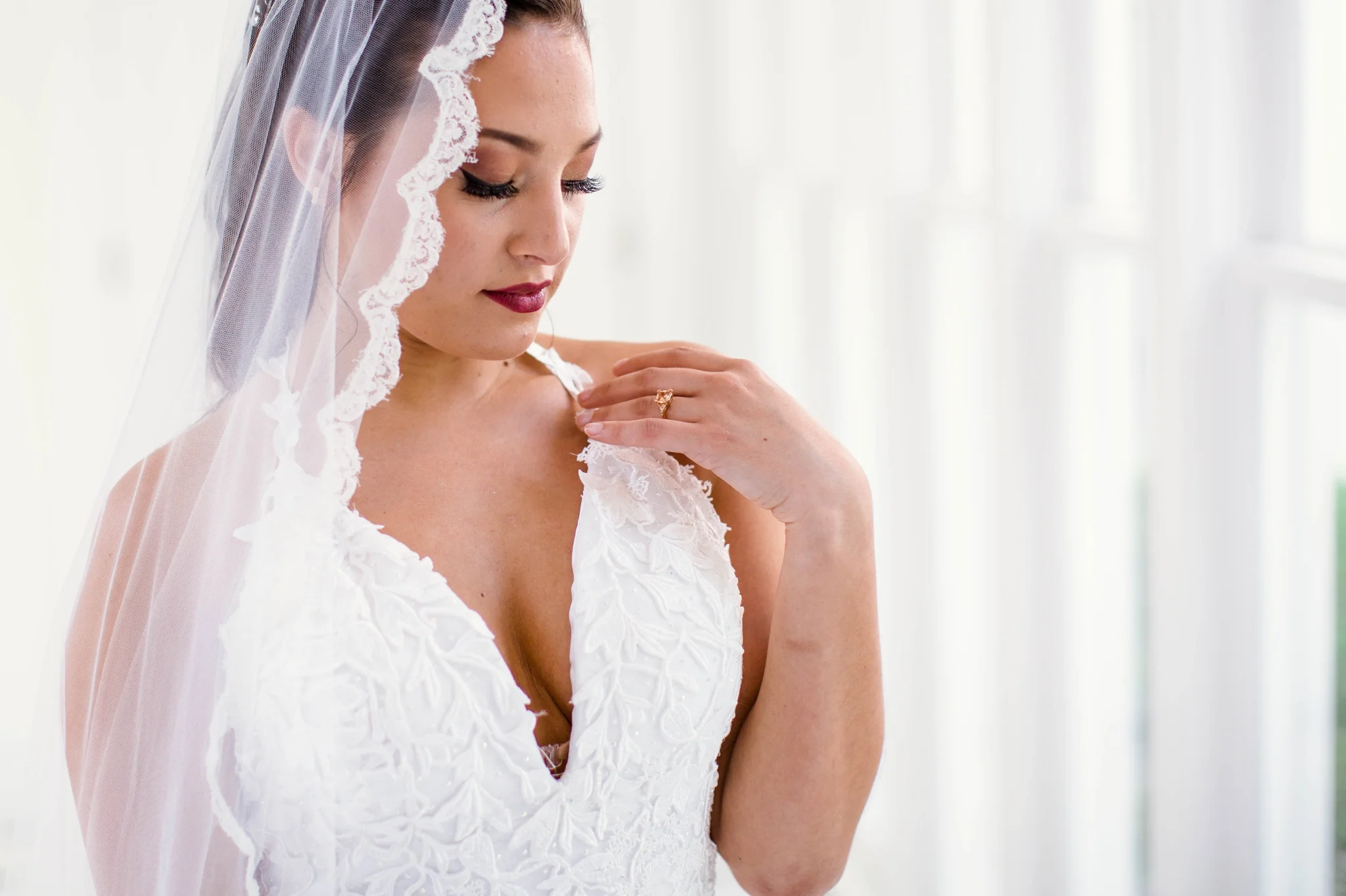 Natural light Bridal Portraits in an all white luxury estate venue with black and white floors and a golden chandelier - Bride is wearing a Ballgown Wedding Dress by Sherri Hill - shot with available window light - Fine Art Wedding Photographer in Honolulu Oahu Hawaii - Johanna Dye Photography - edited with for the love of film presets by jose villa
