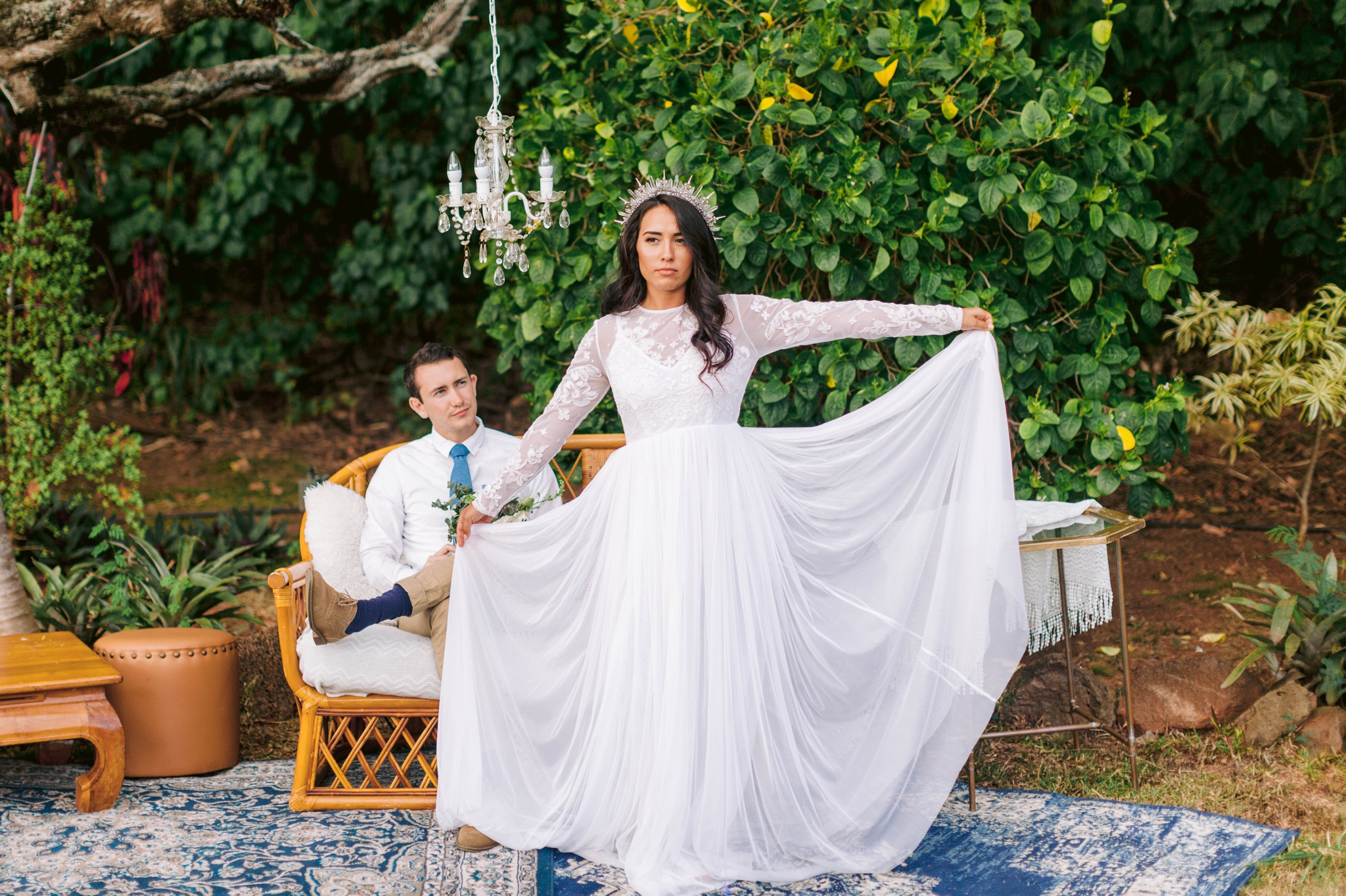  Bride and groom relaxing in an outdoor lounge - bride is wearing a wedding dress by asos and a crystal crown - Ana + Elijah - Wedding at Loulu Palm in Haleiwa, HI - Oahu Hawaii Wedding Photographer 