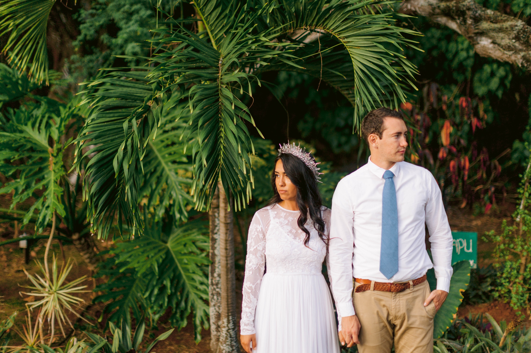 Bride and groom underneath palm trees Ana + Elijah - Wedding at Loulu Palm in Haleiwa, HI - Oahu Hawaii Wedding Photographer - #hawaiiweddingphotographer #oahuweddings #hawaiiweddings 