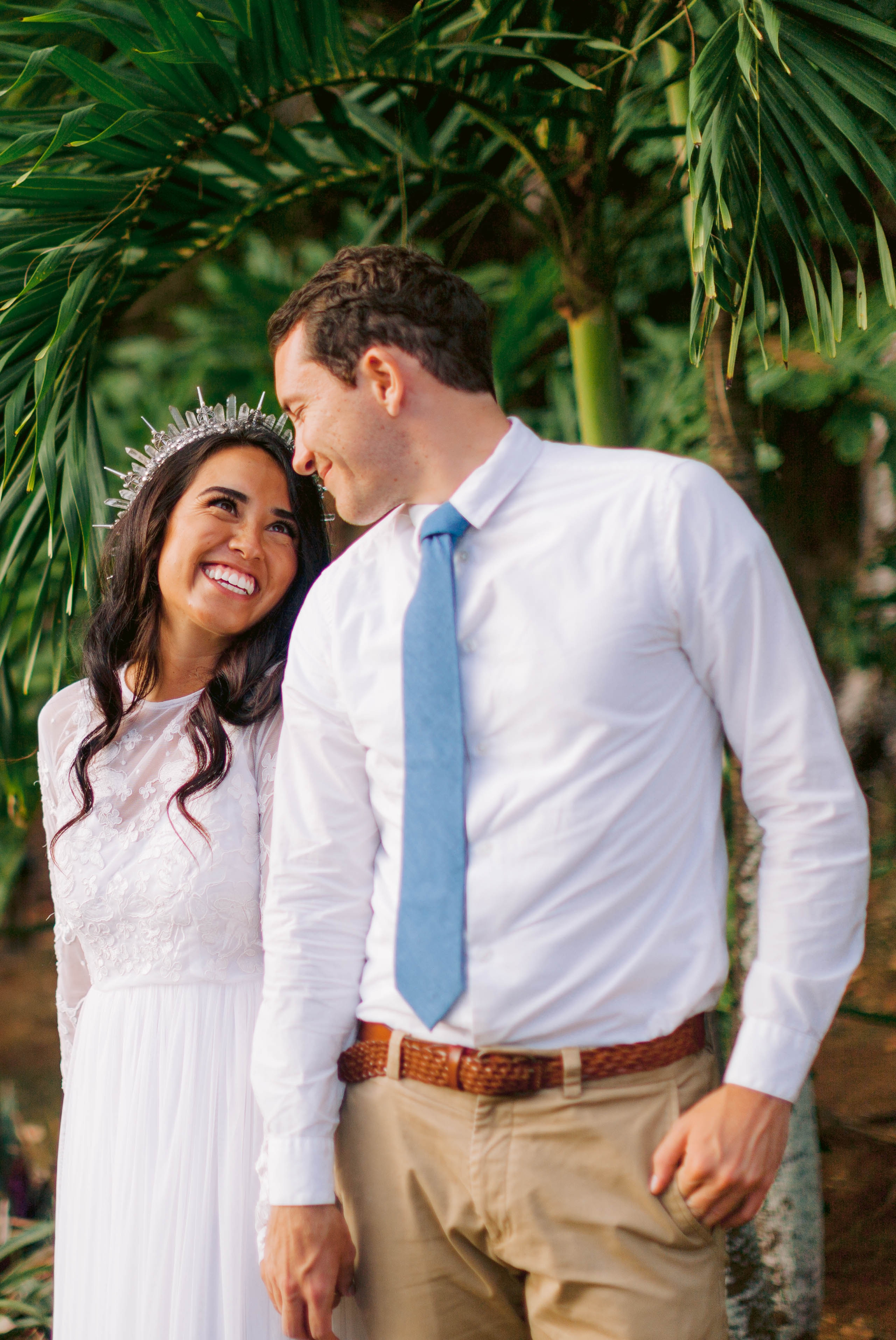 Bride and groom under palm trees - Ana + Elijah - Wedding at Loulu Palm in Haleiwa, HI - Oahu Hawaii Wedding Photographer - #hawaiiweddingphotographer #oahuweddings #hawaiiweddings 