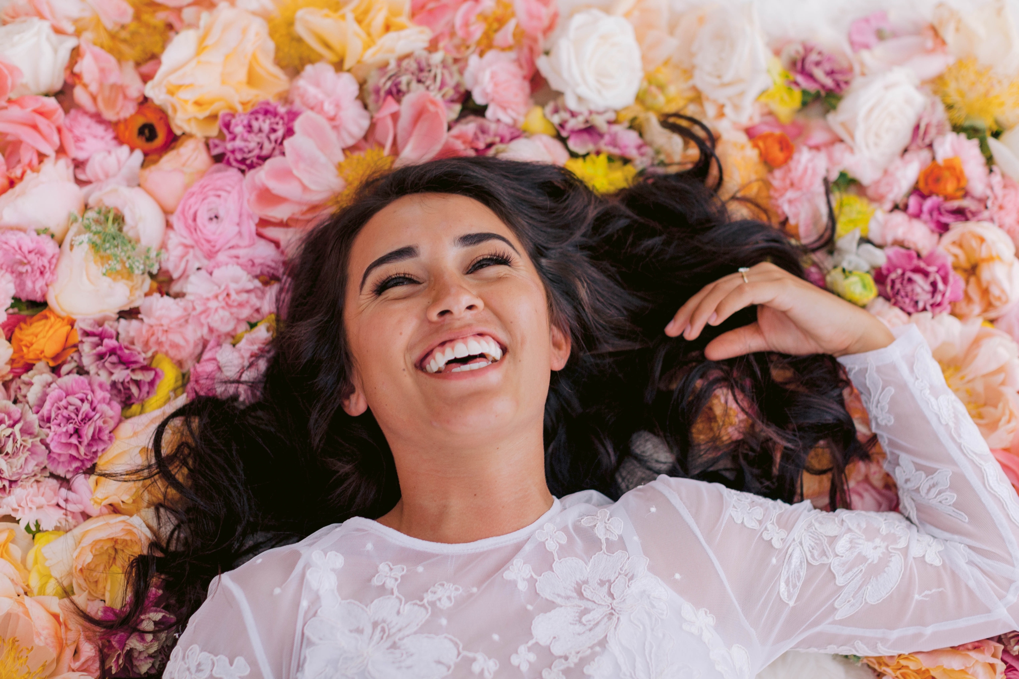 Bridal Portraits - Bride laying on a bed of flowers - Ana + Elijah - Wedding at Loulu Palm in Haleiwa, HI - Oahu Hawaii Wedding Photographer - #hawaiiweddingphotographer #oahuweddings #hawaiiweddings