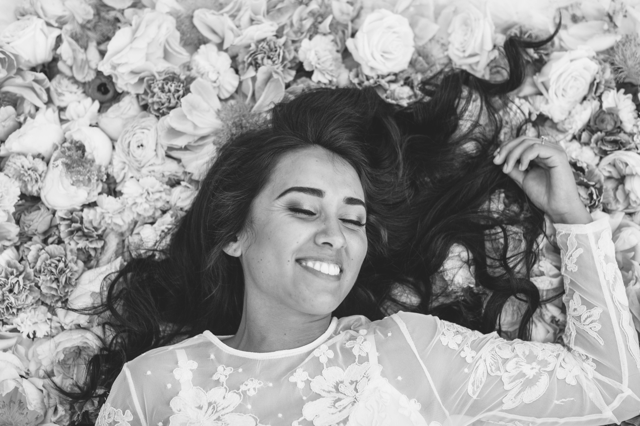 Bridal Portraits - Bride laying on a bed of flowers - Ana + Elijah - Wedding at Loulu Palm in Haleiwa, HI - Oahu Hawaii Wedding Photographer - #hawaiiweddingphotographer #oahuweddings #hawaiiweddings