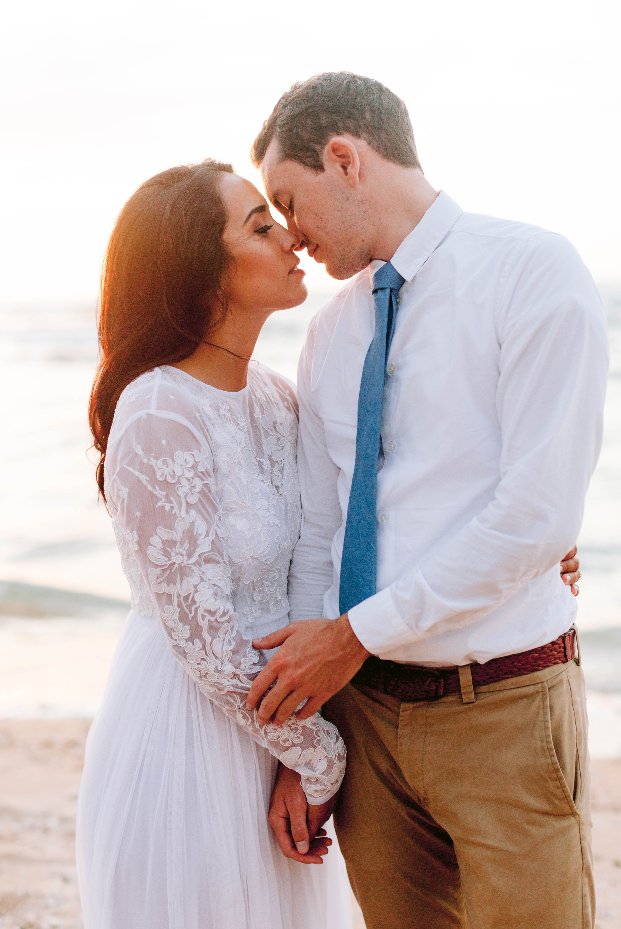  Bride and Groom Kissing - Beach Wedding Portraits at Sunset in Hawaii - Ana + Elijah - Wedding at Loulu Palm in Haleiwa, HI - Oahu Hawaii Wedding Photographer - #hawaiiweddingphotographer #oahuweddings #hawaiiweddings 