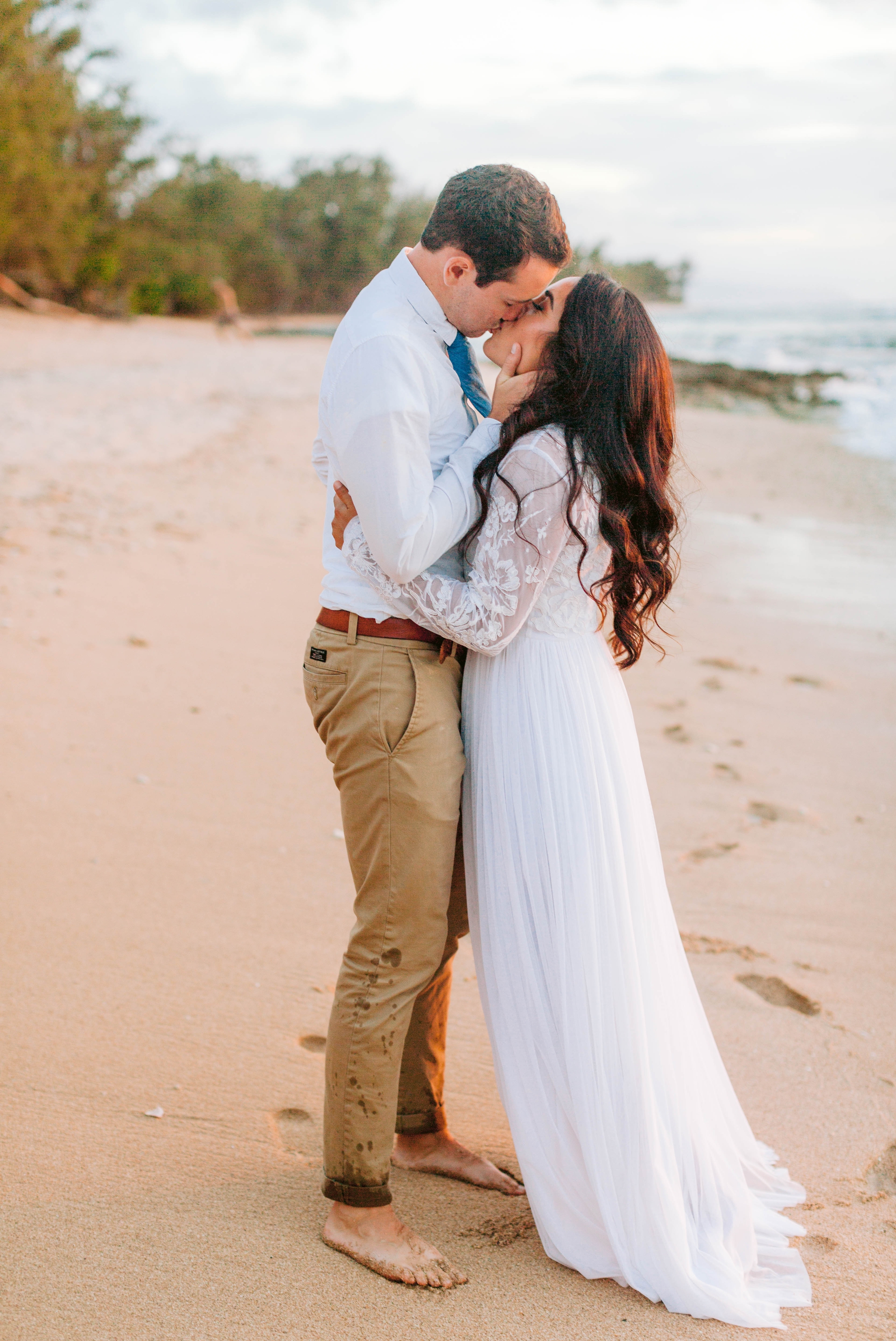  Bride and Groom kissing - Wedding Portraits at Sunset in Hawaii - Ana + Elijah - Wedding at Loulu Palm in Haleiwa, HI - Oahu Hawaii Wedding Photographer - #hawaiiweddingphotographer #oahuweddings #hawaiiweddings 