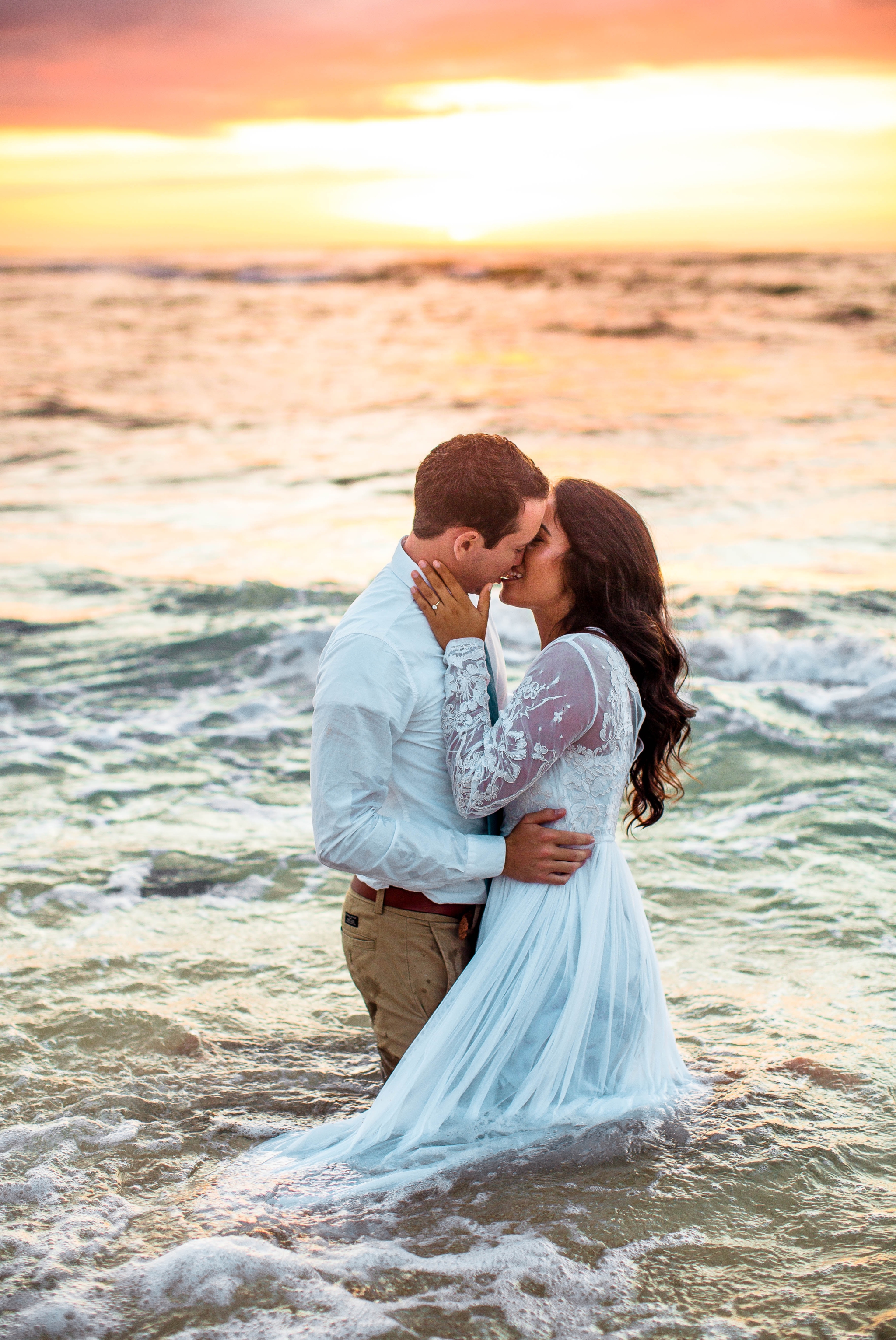  Bride and Groom in the ocean - Wedding Portraits at Sunset in Hawaii - Ana + Elijah - Wedding at Loulu Palm in Haleiwa, HI - Oahu Hawaii Wedding Photographer - #hawaiiweddingphotographer #oahuweddings #hawaiiweddings 