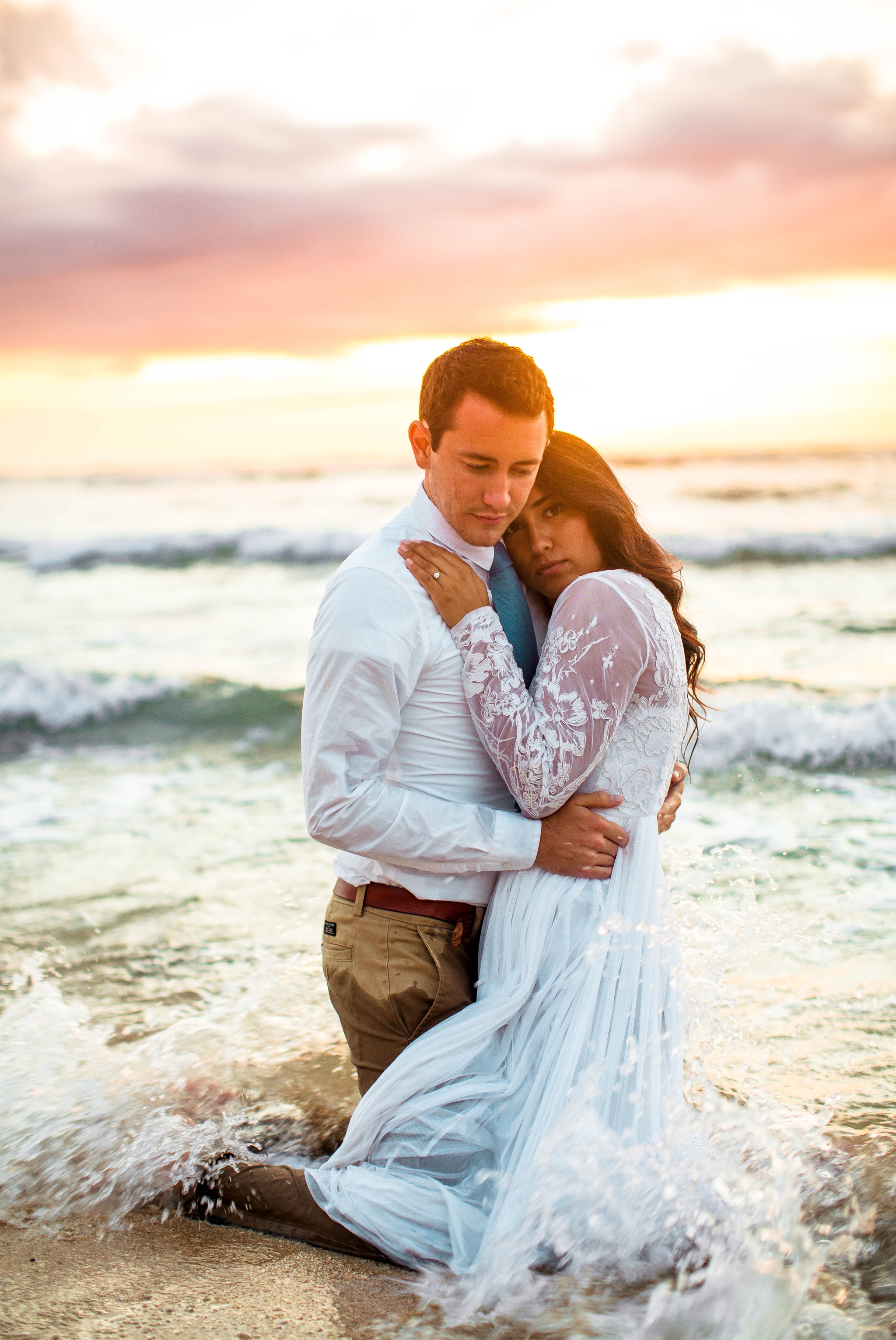  Bride and Groom in the ocean - Wedding Portraits at Sunset in Hawaii - Ana + Elijah - Wedding at Loulu Palm in Haleiwa, HI - Oahu Hawaii Wedding Photographer - #hawaiiweddingphotographer #oahuweddings #hawaiiweddings 