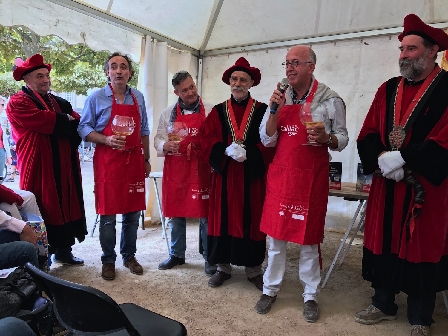 The tough life of a writer of wine mysteries: Induction ceremony to become members of the Gaillac Wine Brotherhood of the Dive Bouteille.