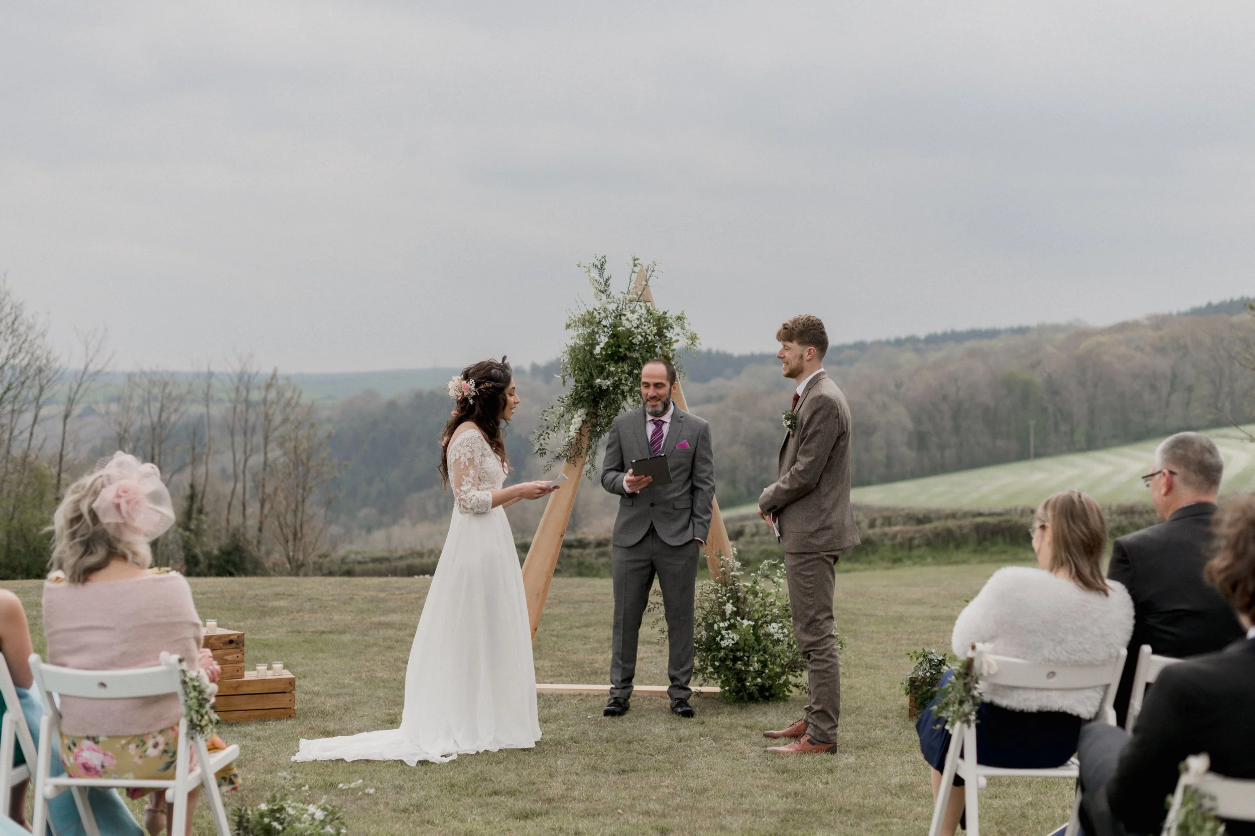 outdoor christian wedding ceremony at Camel Studio a micro wedding venue in Cornwall overlooking the Camel Valley