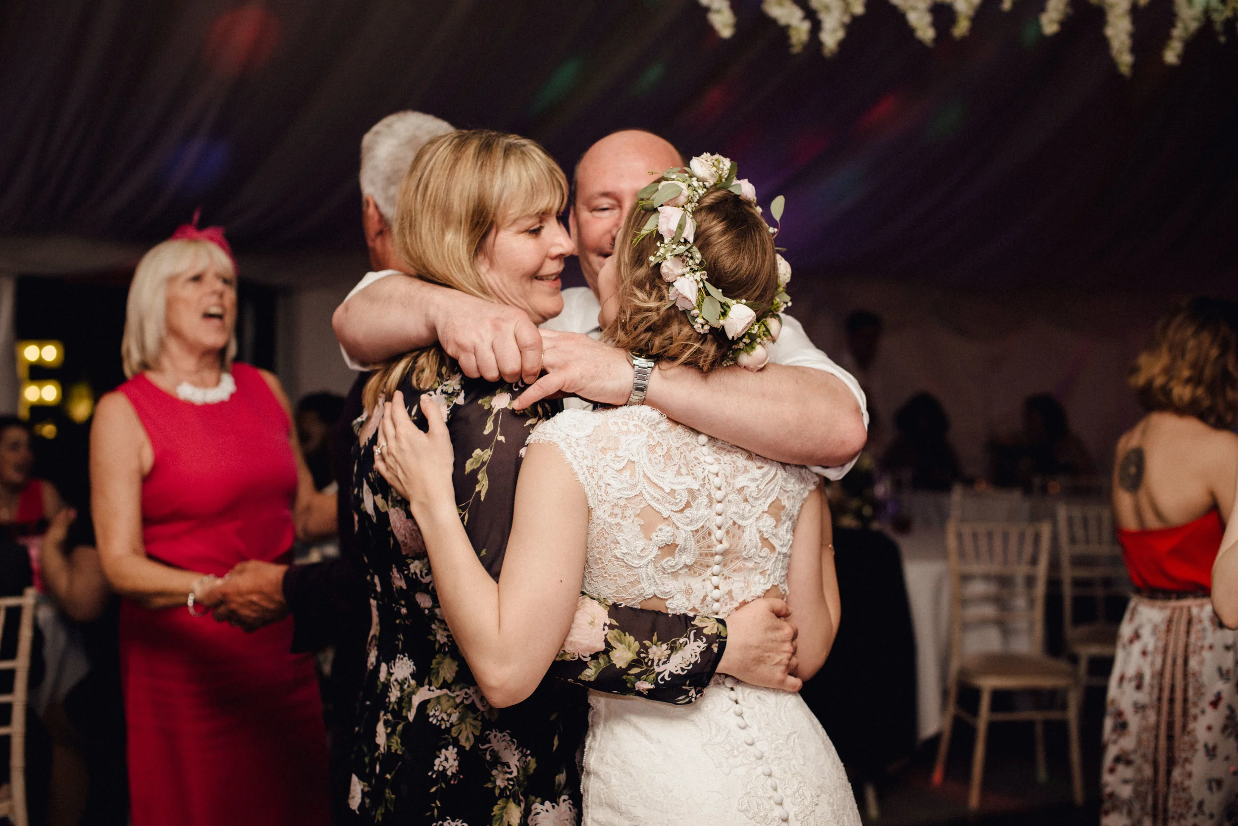 I love this squishy moment on the dance floor where Megan shares a moment with her parents. These guys are family goals!