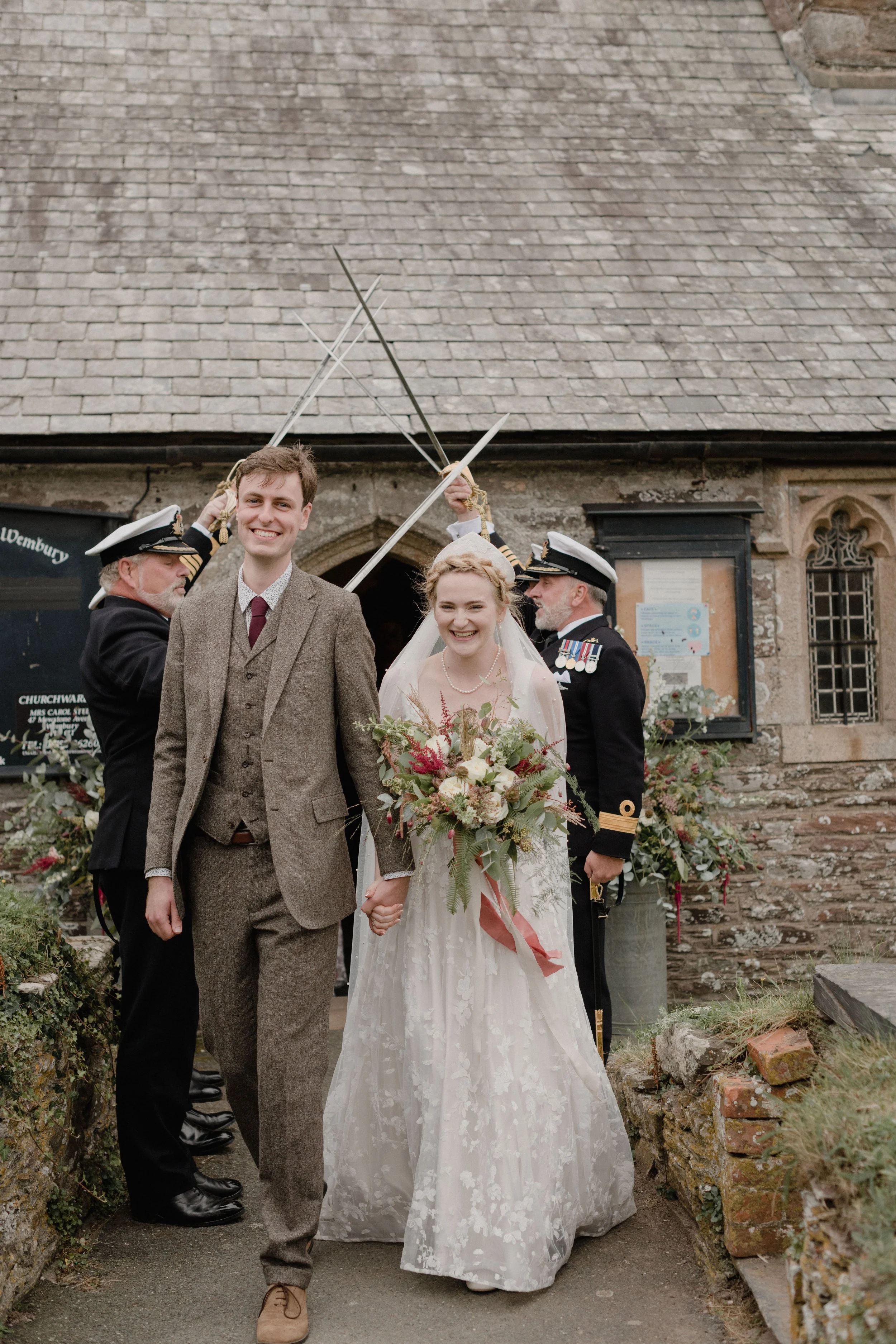 guard of honour for autumnal inspired wedding in devon at Wembury church