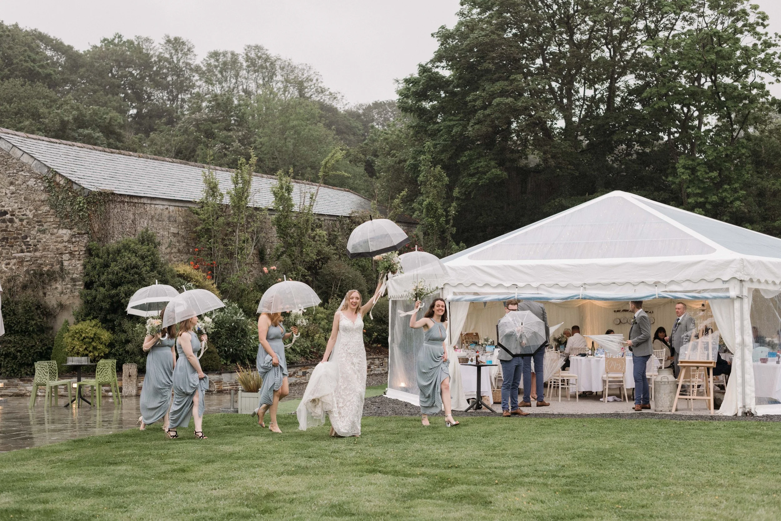 natural documentary reportage wedding photography southwest penzance bridesmaids in the rain