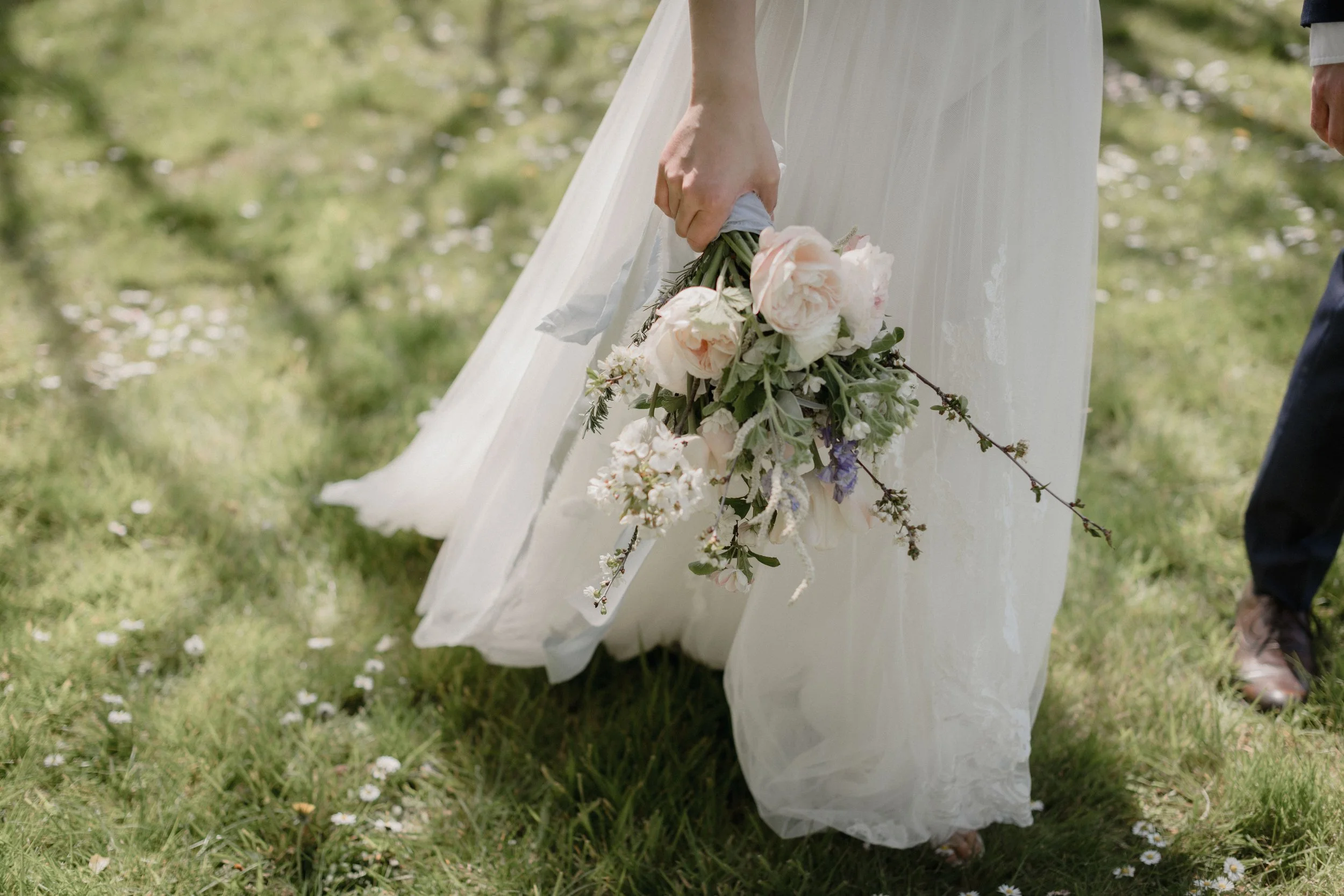 Elegant Boho bride with Meadowfolk bouquet for an elopement at Treseren, a micro wedding venue in Cornwall