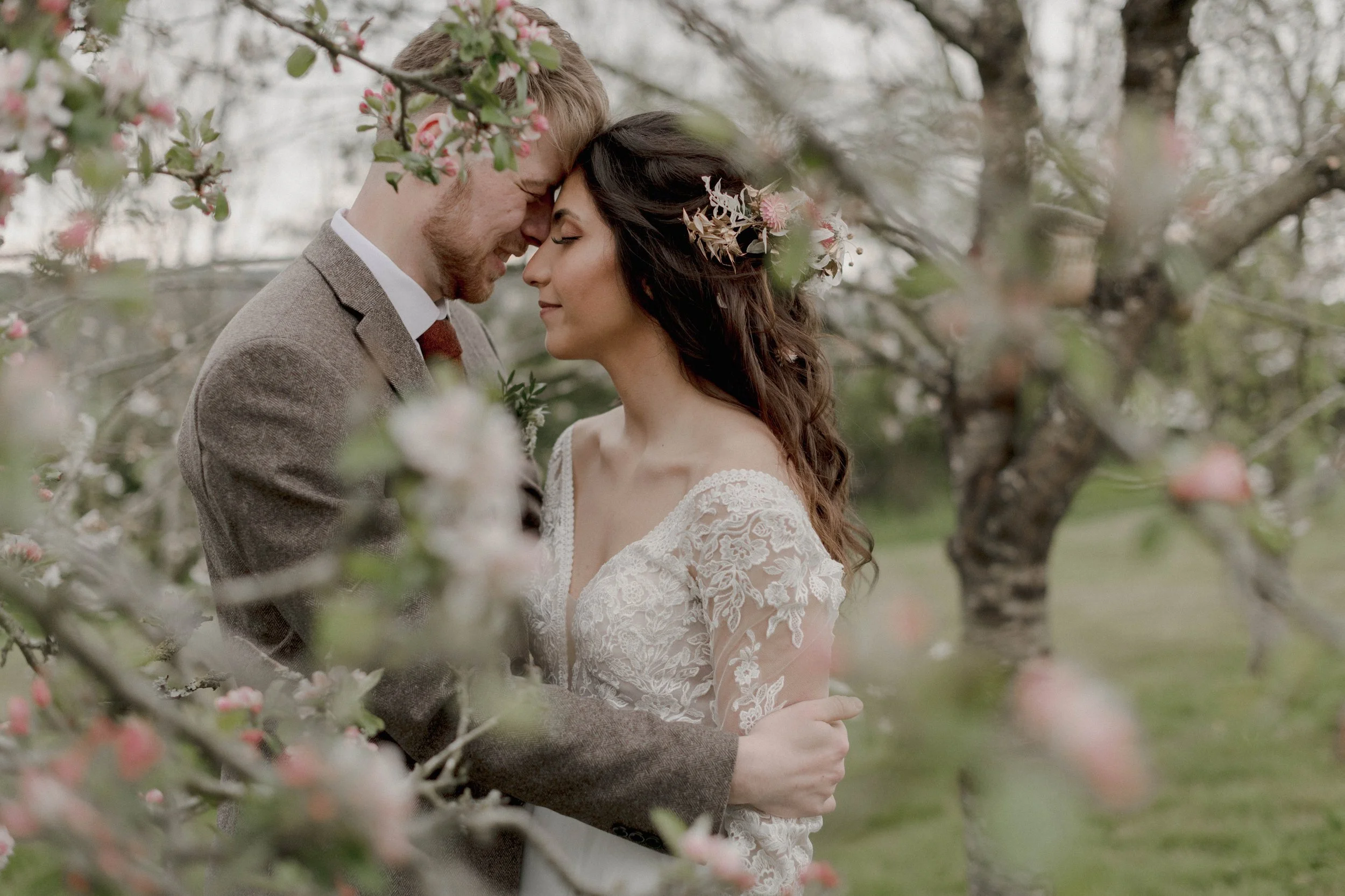 romantic intimate wedding photography among the cherry blossoms at this micro wedding venue in cornwall