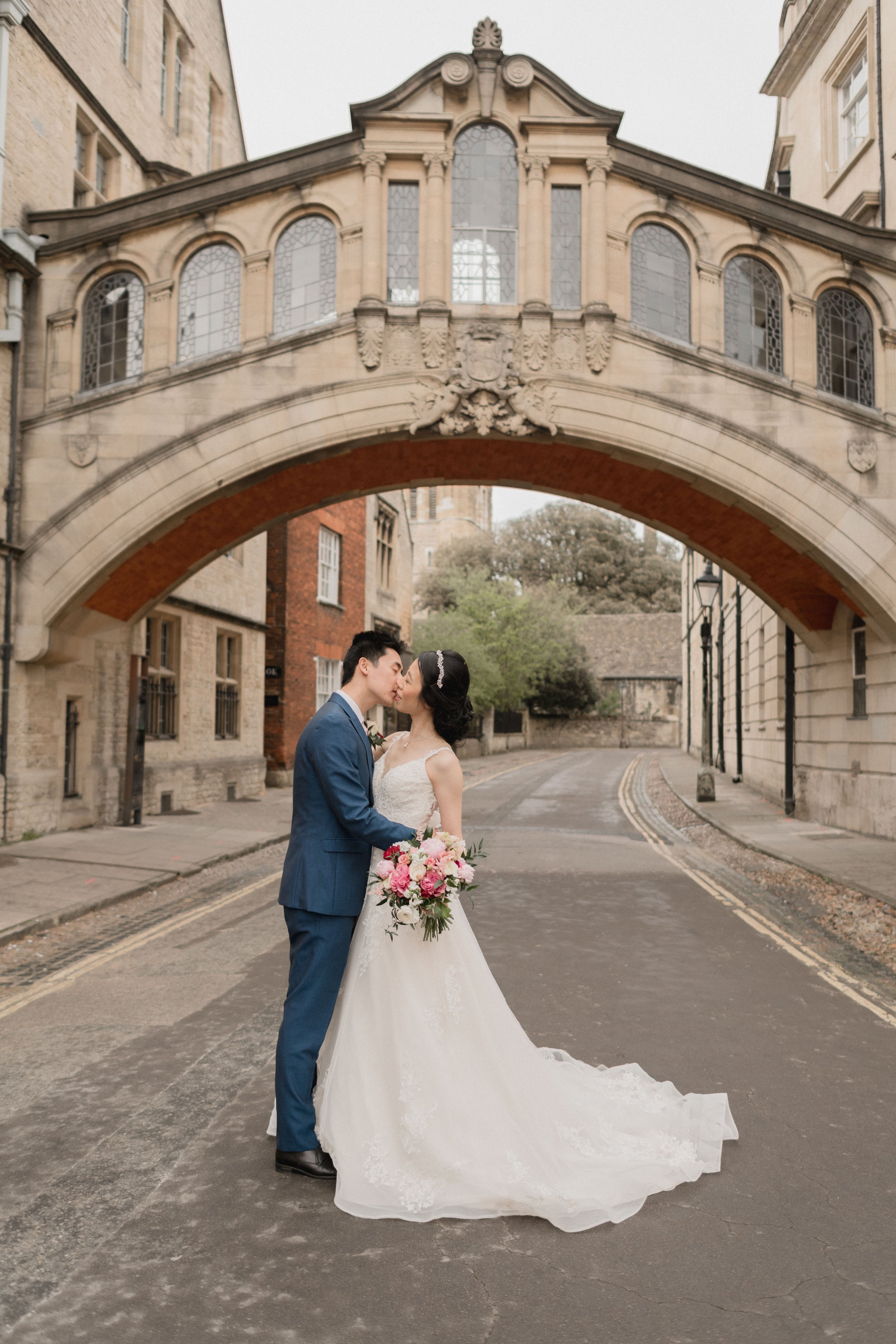 an elopement wedding in Oxford with romantic couple photos beneath the bridge of sighs