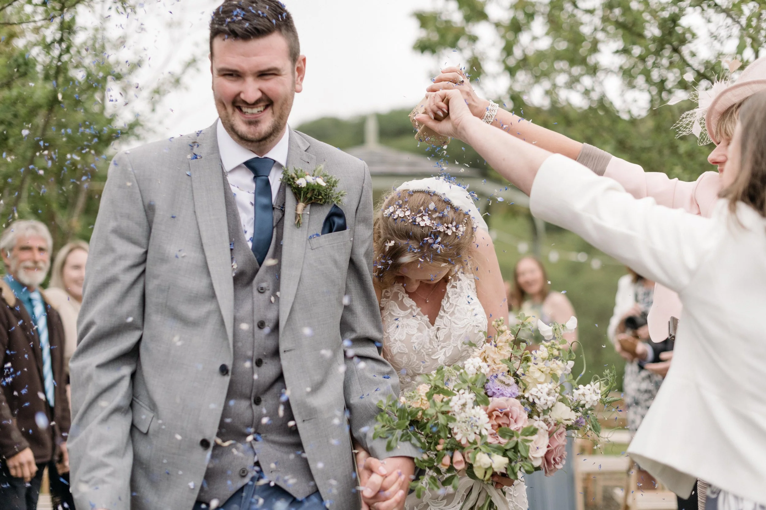 a petal confetti explosion at Amber & Ryan's wildflower intimate wedding in cornwall