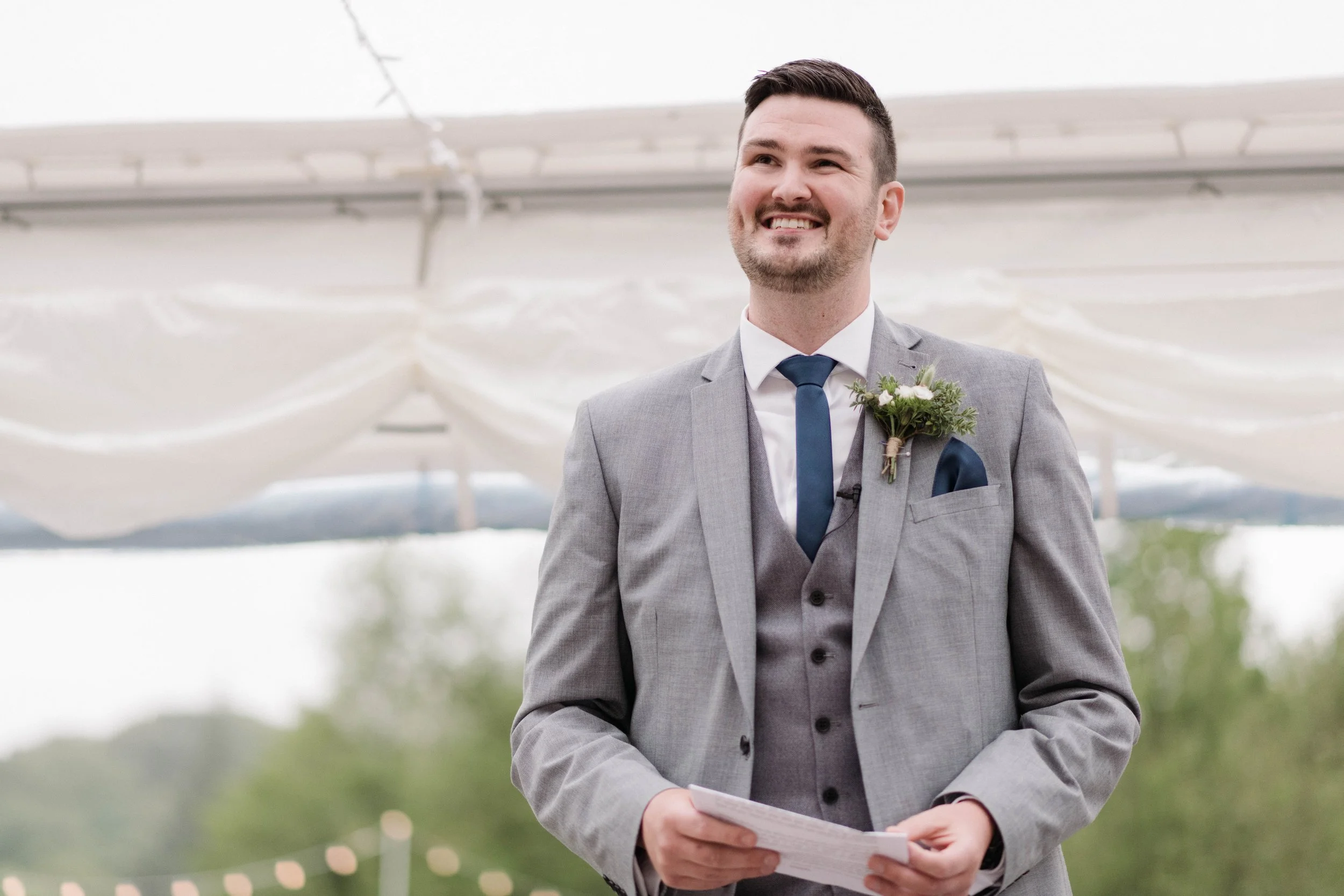 groom delivers speech at outdoor marquee wedding in cornwall
