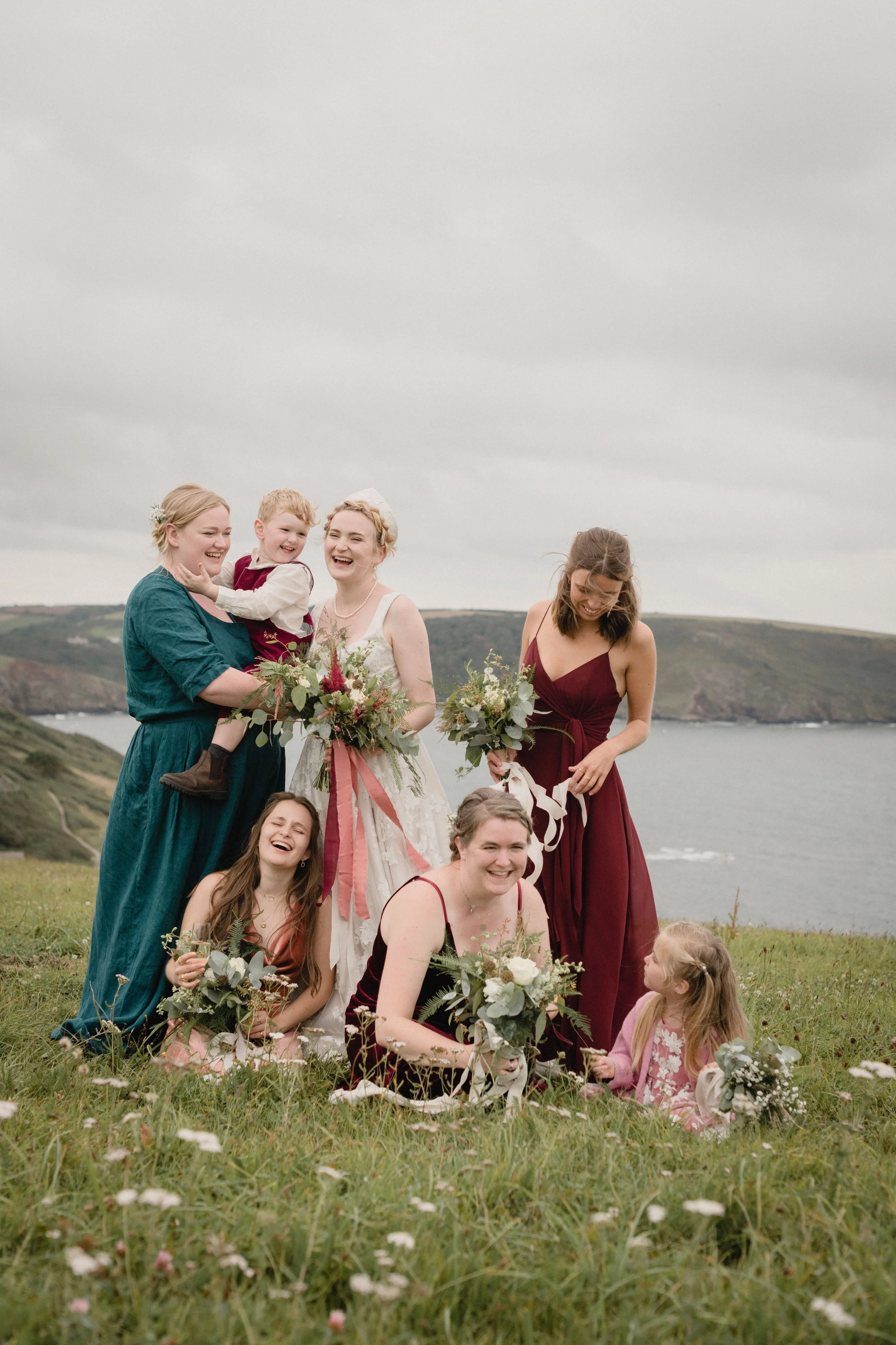 velvet bridesmaids in jenny yoo at a seaside wedding in devon with russian bridal tiara