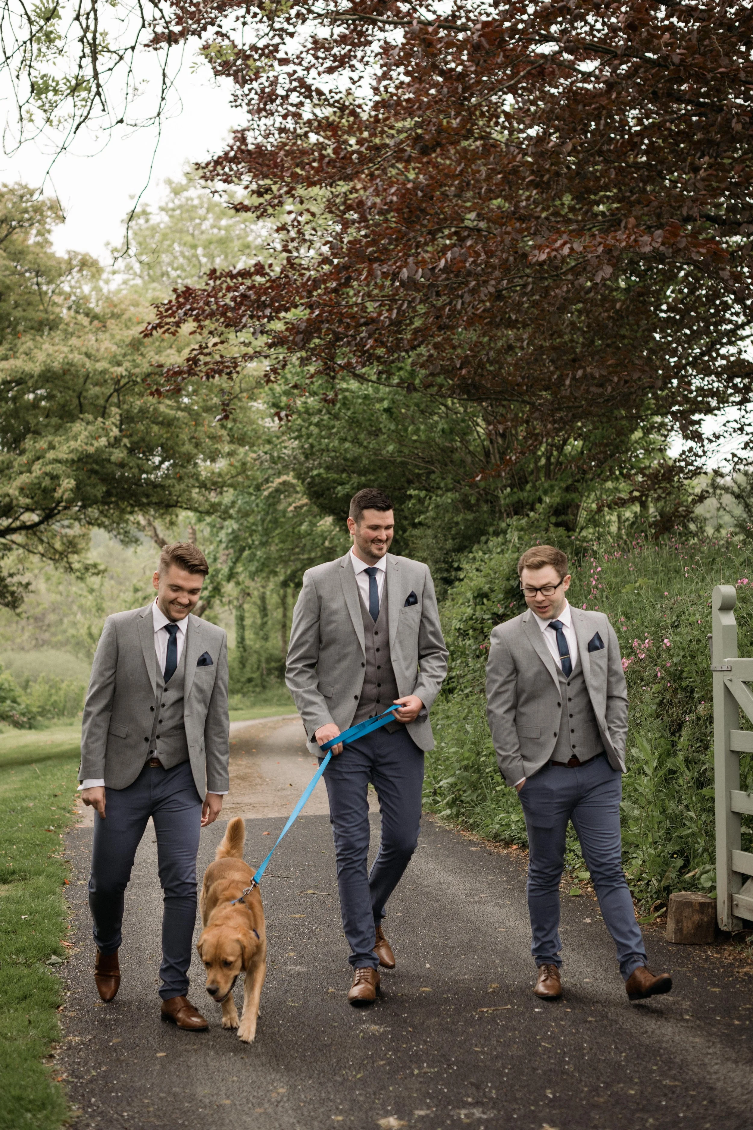 groomsmen with the grooms pet dog at their cornwall spring wedding