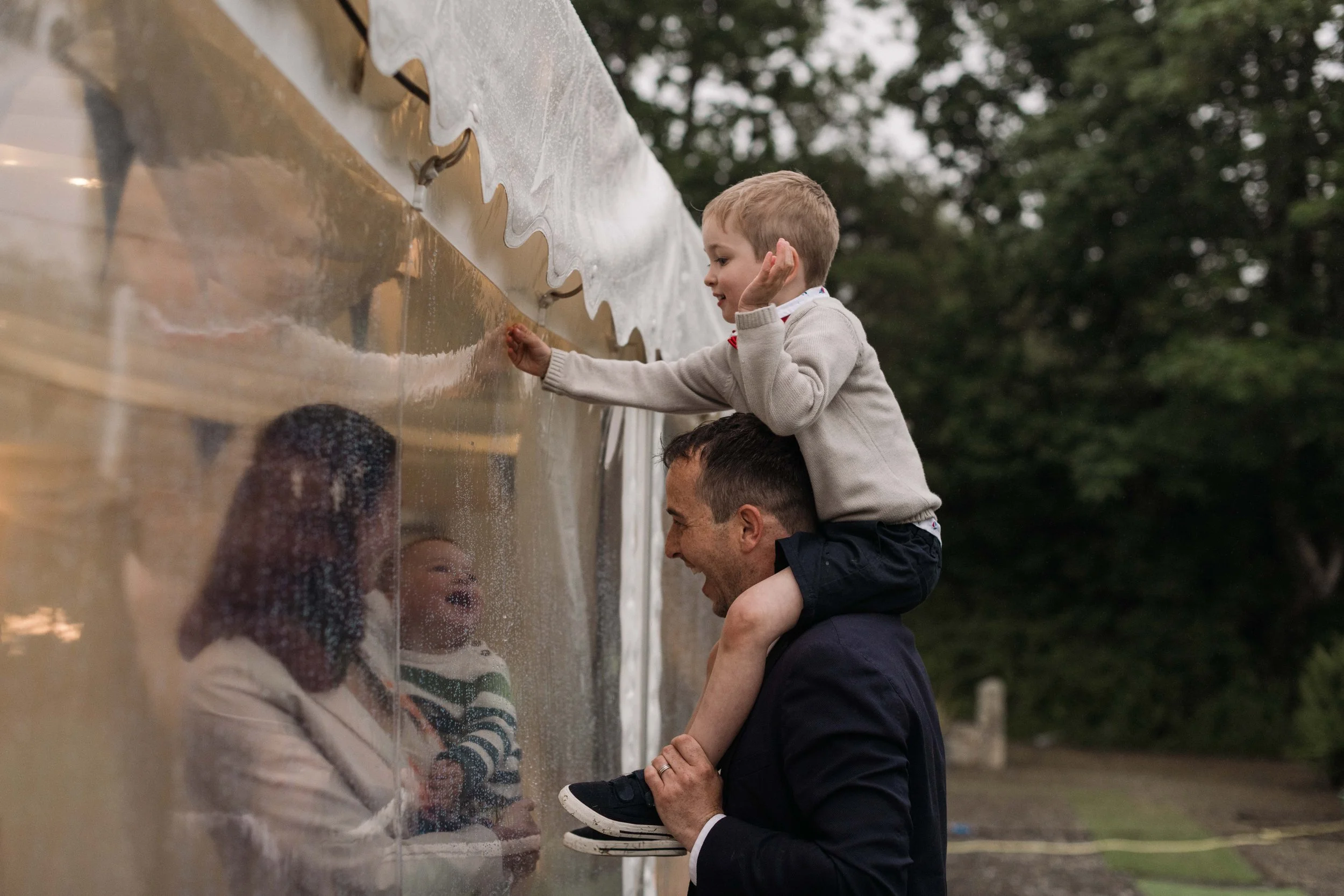 reportage wedding photography of children playing at outdoor venue in cornwall