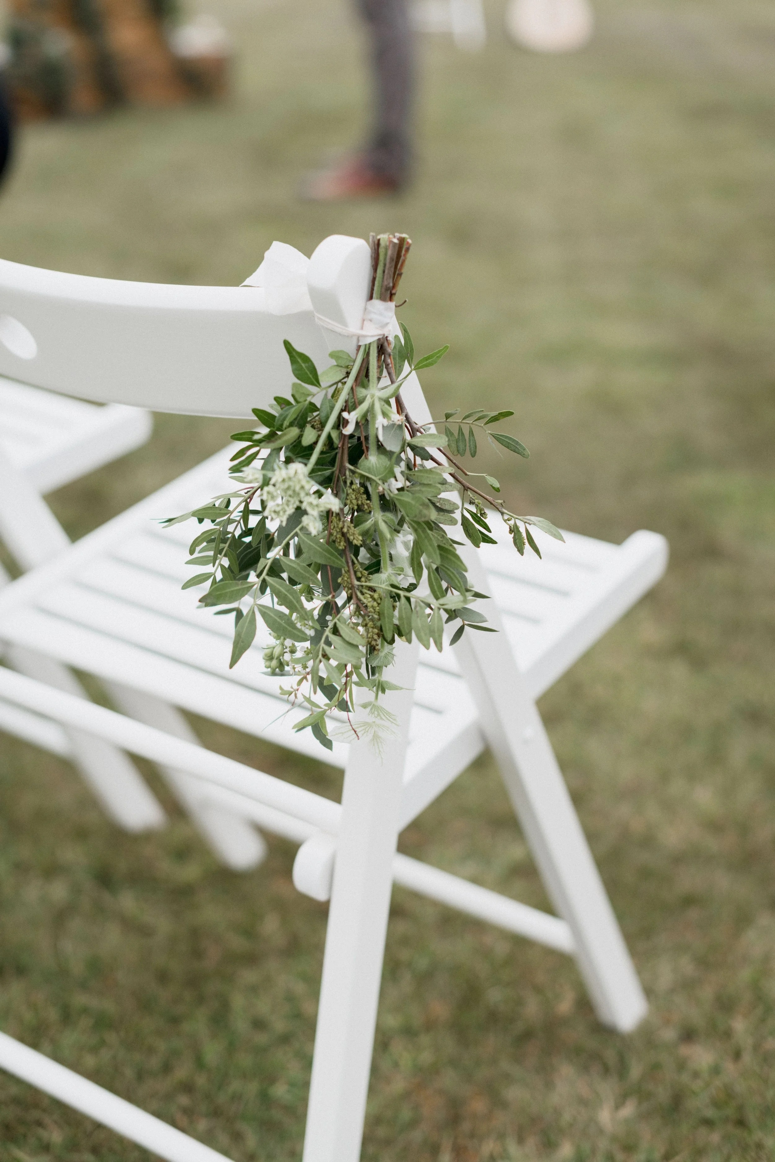 intimate wedding inspiration flower decorations for the chairs