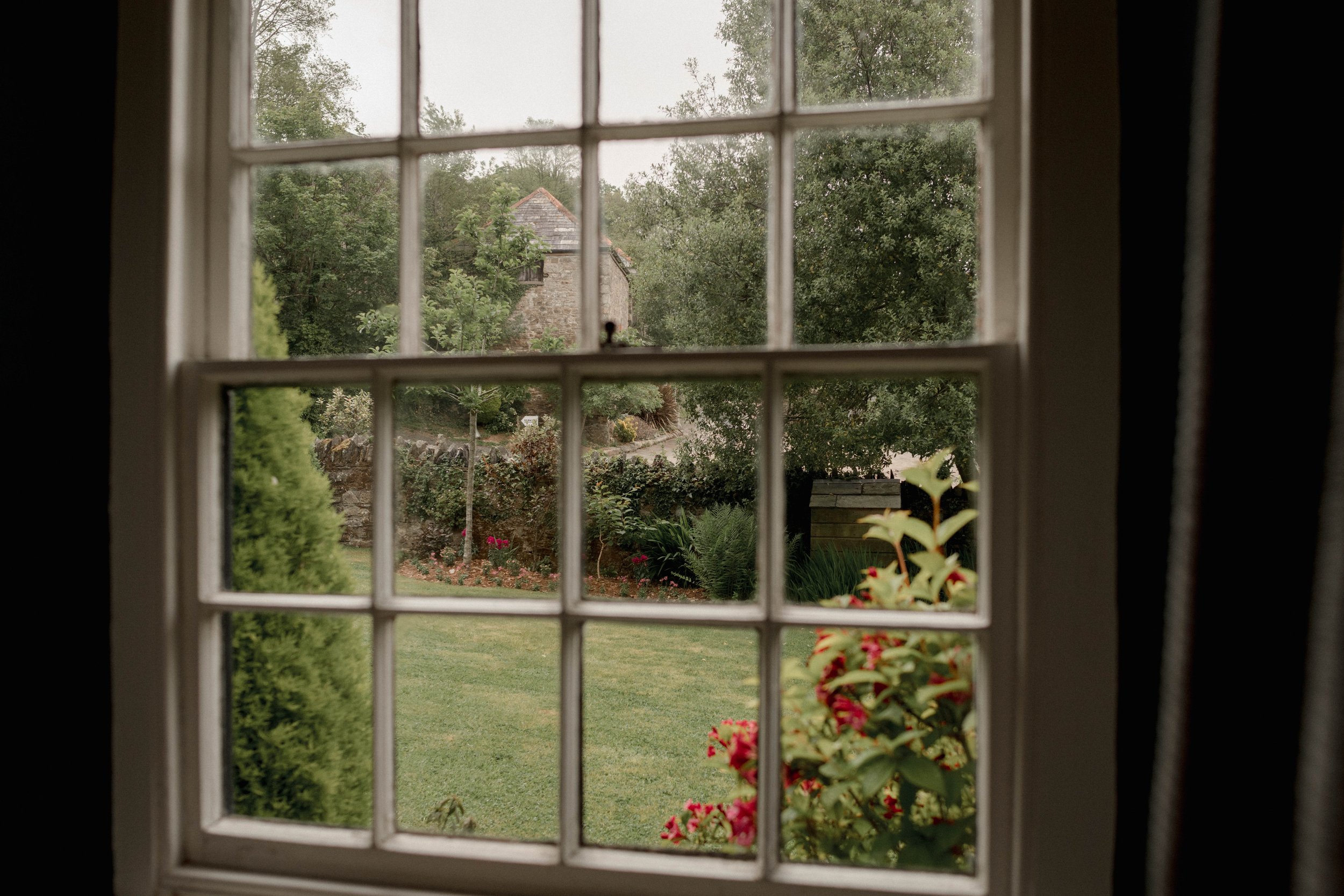 window scenes of the spring gardens on a grey day at pengenna manor