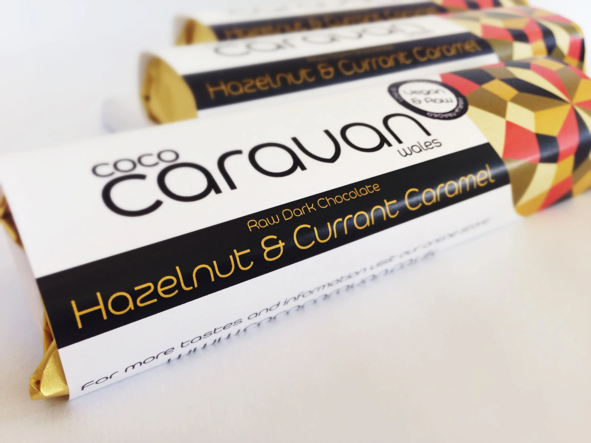 chocolate bar filled with roasted hazelnuts, currants and a smooth vegan caramel based on cashew nut, coconut and coconut sugar - made by Coco Caravan