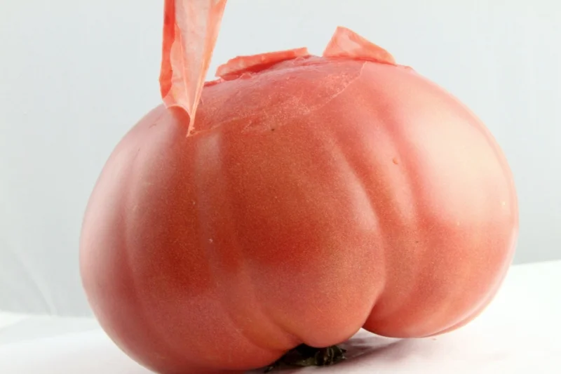 Pink tomatoes have clear skin and pink or red flesh.