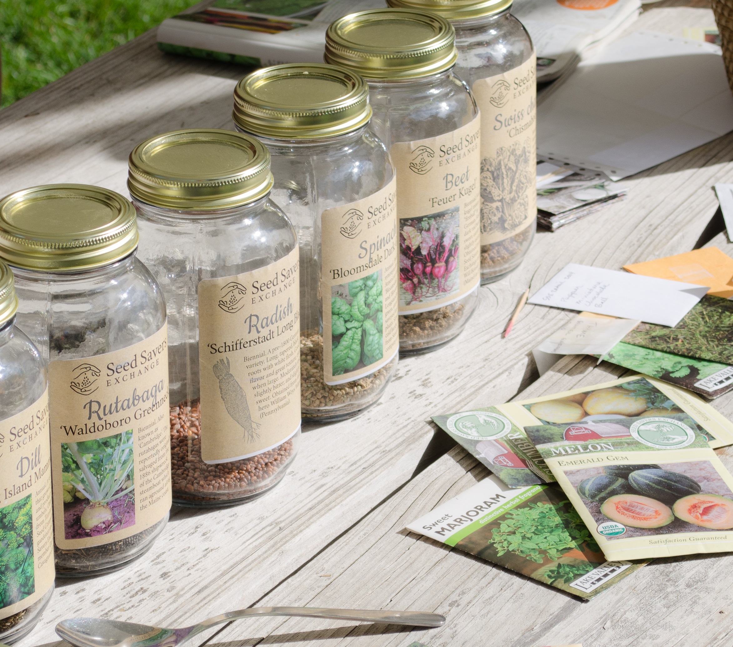 Packets and mason jars are among the containers used to display seeds at seed swaps. Plastic BagGies work well too. 