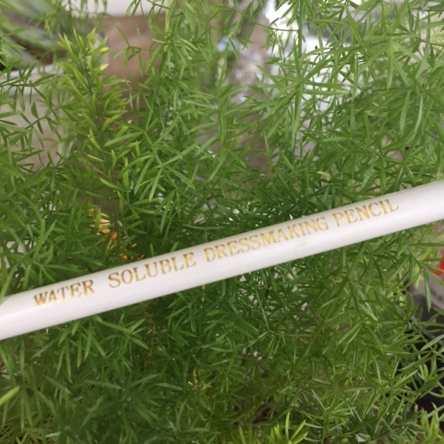 Here's a close-up of the white pencil I used to mark my lines. It really helps! The white pencil comes off in the wash. 