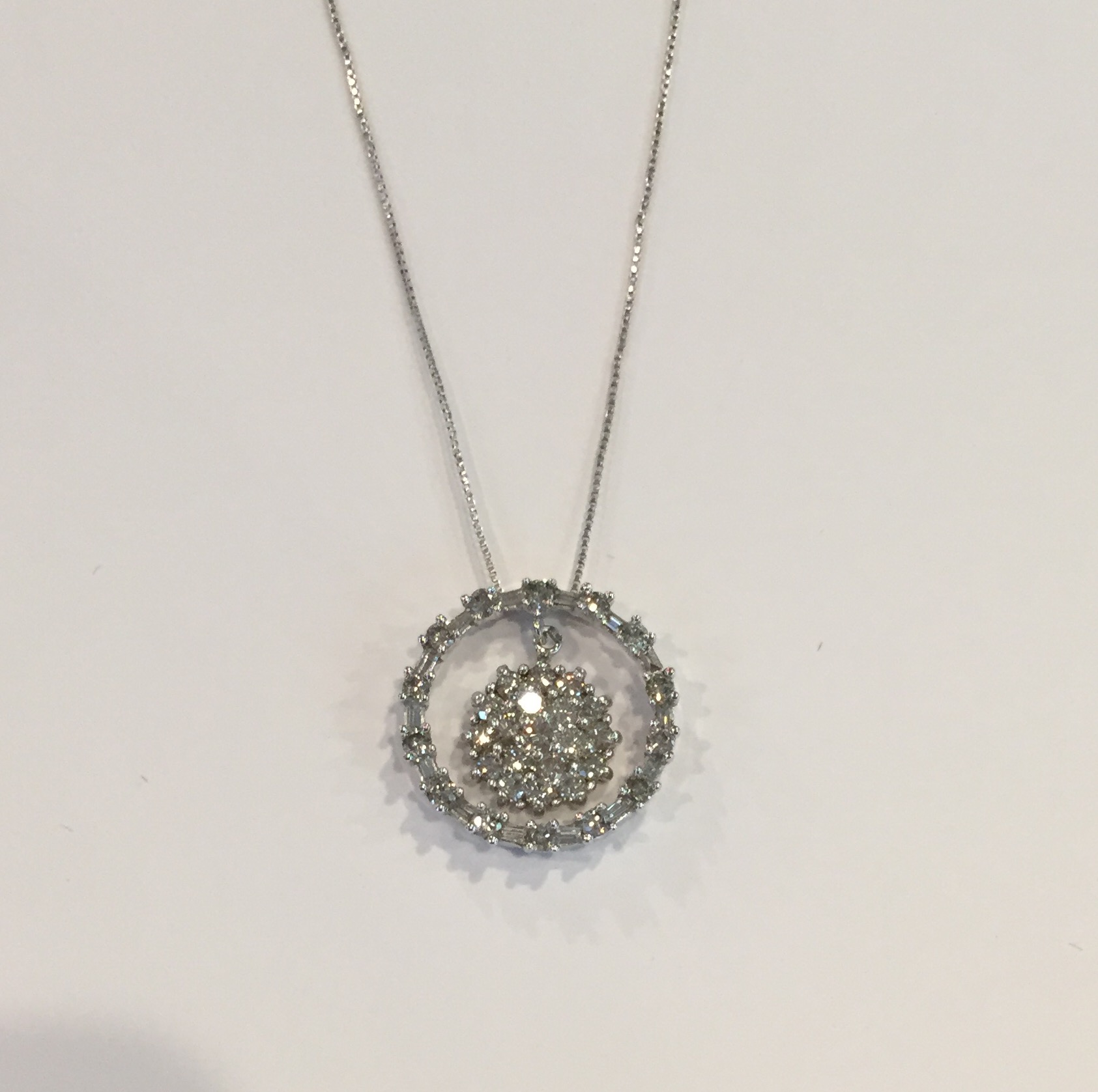 Item No. 284 USD775 Stamped 14k and 10K White Gold Diamond Pendant with 14k Chain. Outside is 10K and inside and chain are 14k Approximately a carat of quality baguette and round shaped diamonds in this charming necklace. Classic gift. 3.4 grams