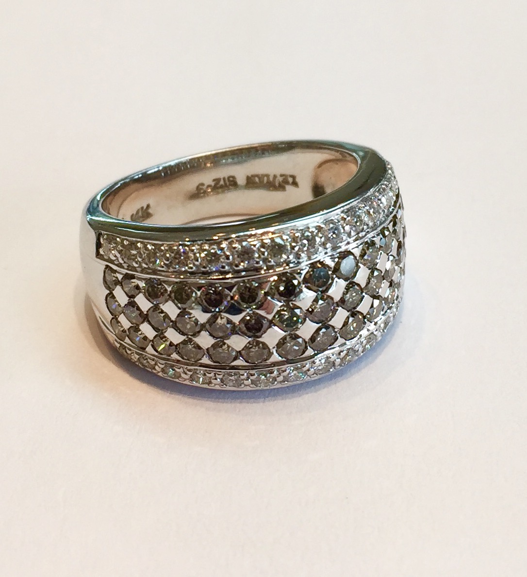 Item No. A141 USD1,045 14K Diamond Band A modern classic from the very popular designer Le Vian. 1.65carats of white and chocolate diamonds. Certainly a little bit different and in such a nice way. Dazzle everyone with this beautiful ring. Solid 7.2 grams