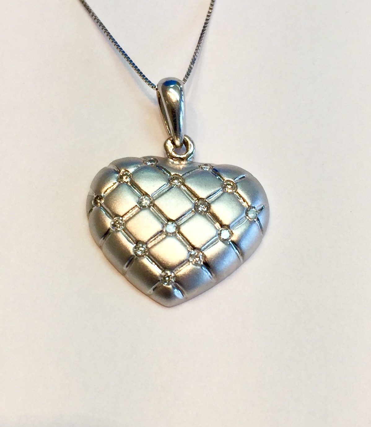 Item No L5 USD395 14K White Gold Diamond Necklace Brushed/matte finish on this lovely heart necklace with quality diamonds at each intersection. 4.3 grams