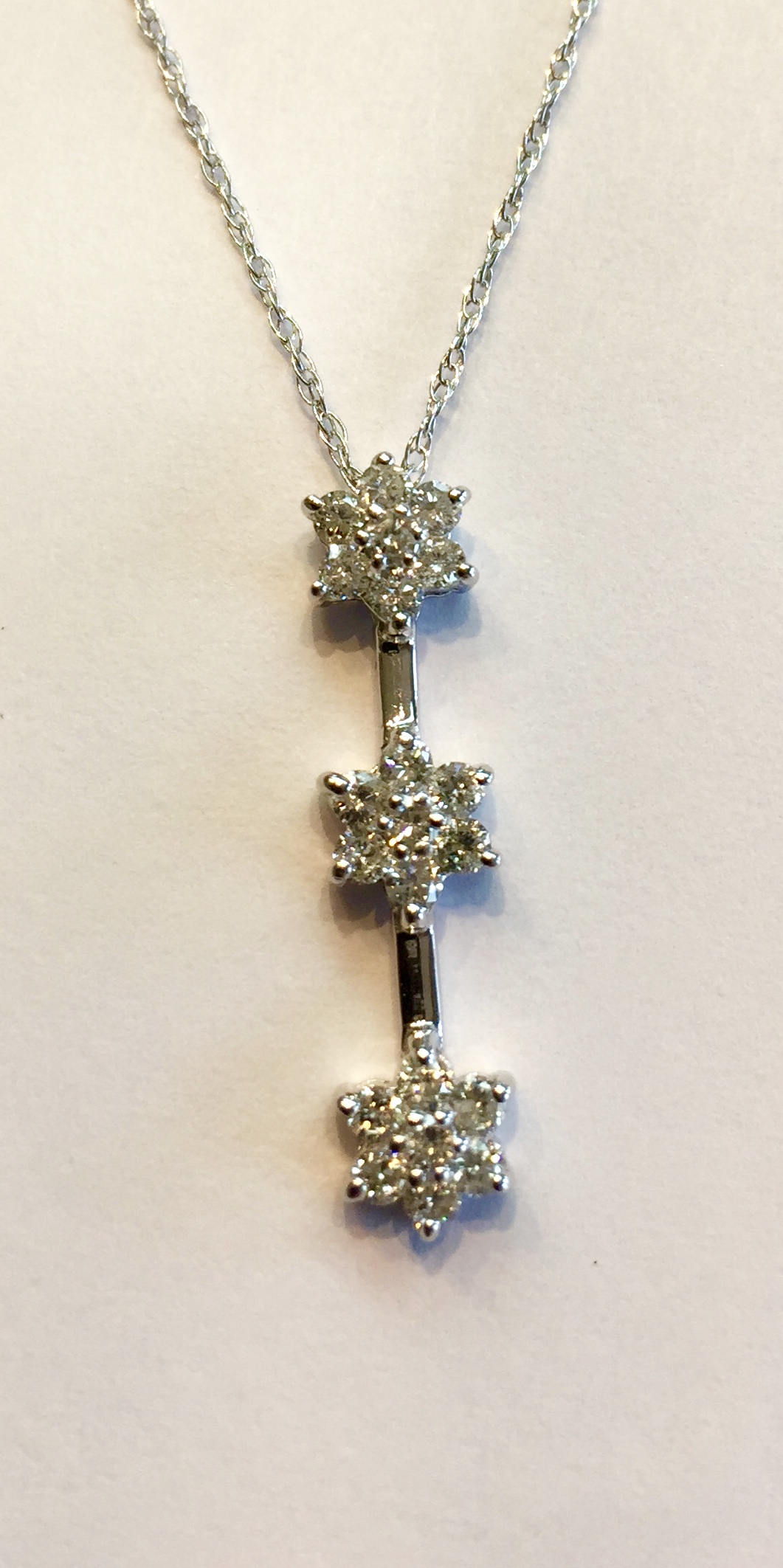 Item No A174 USD395 14k White Gold Diamond Necklace 3 piece drop flower diamond necklace. Approximately .56 carat of sparkling diamonds in this charming piece. A gift perhaps !