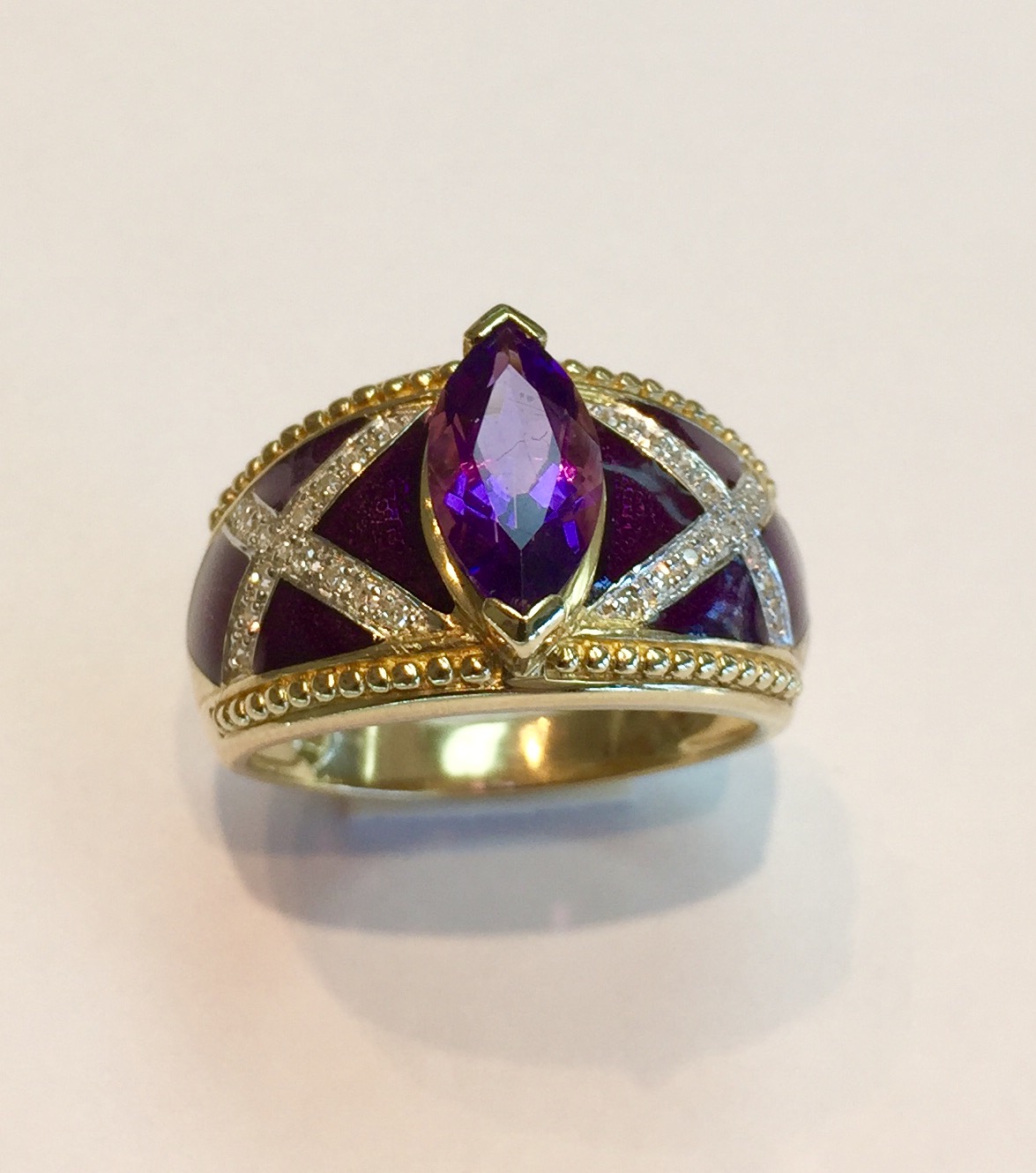 Item No A193 USD745 14K Yellow Gold Amethyst Enamel Diamond Ring If you like enameled jewelry then do not miss out on this unique ring. 1.6 carat marquis amethyst and .25 carat diamonds and a substantial 8.4 grams of gold. Be different !