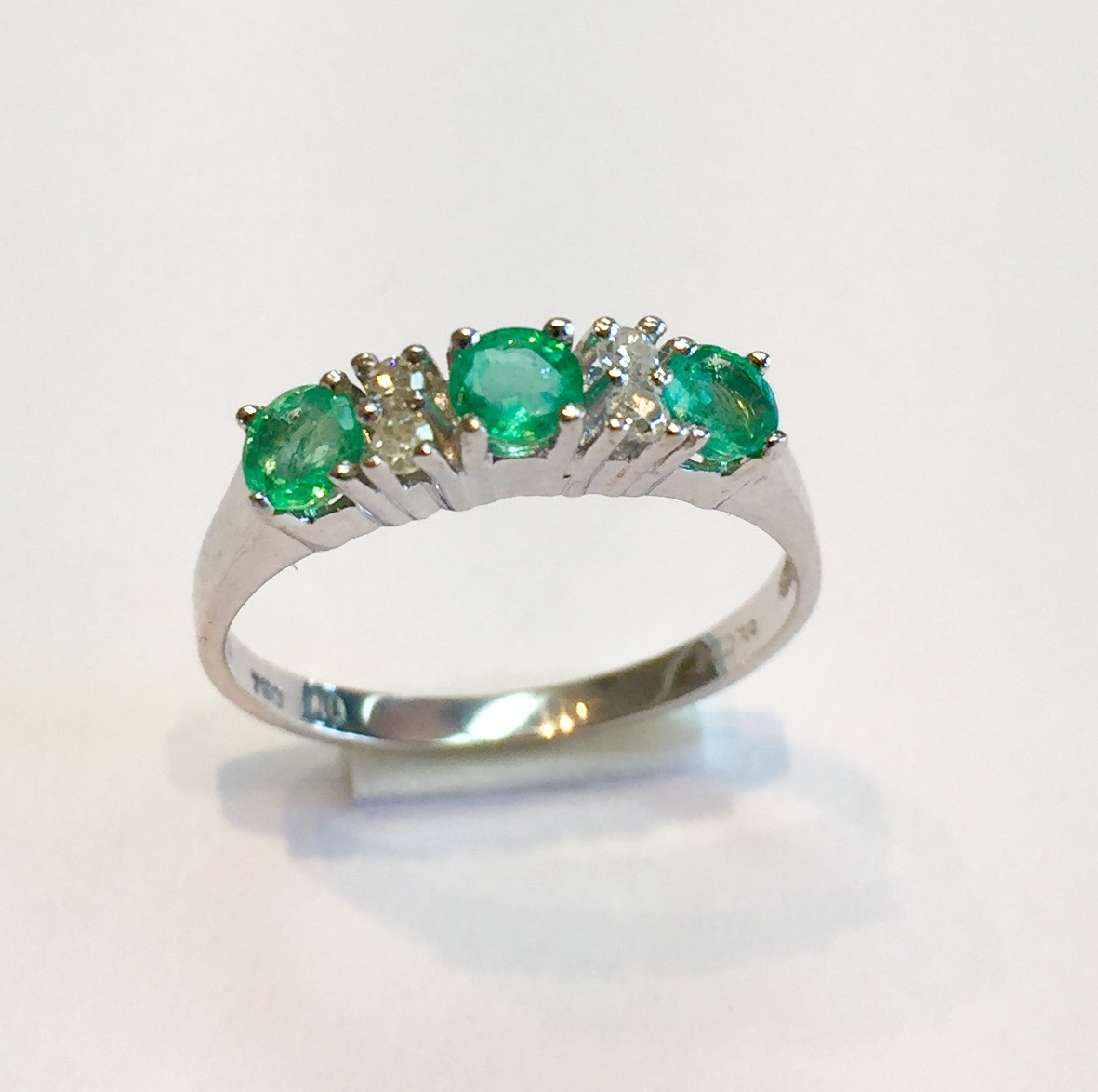 Item No A231 USD395 18K White Gold Emerald and Diamond Ring .75 carat of clear light colored emeralds with .12 carat of sparkling diamonds. Classic and timeless. 