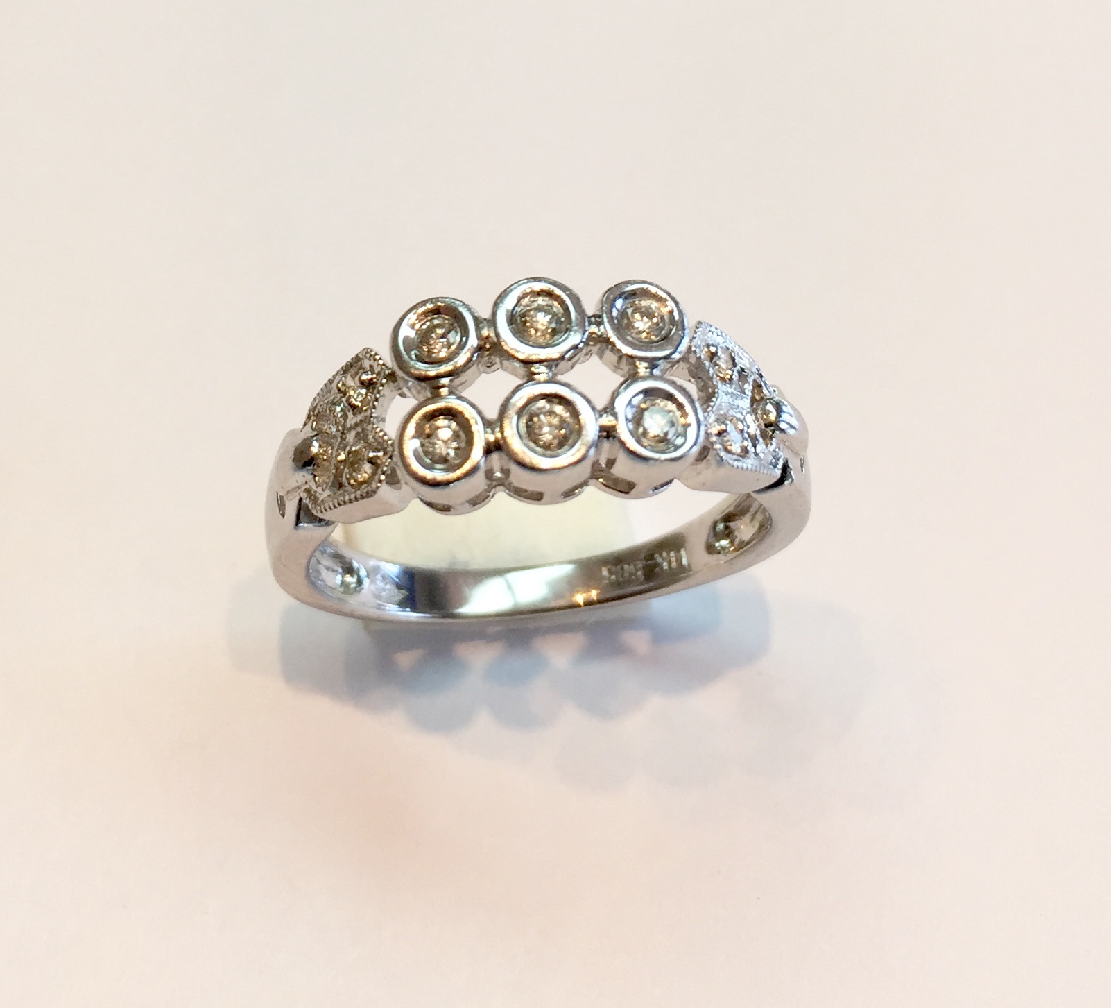 Item No AB6 USD 295 14k White Gold Diamond Ring A quarter carat of bezel set diamonds in this modern and charming ring. Great ring at a great price