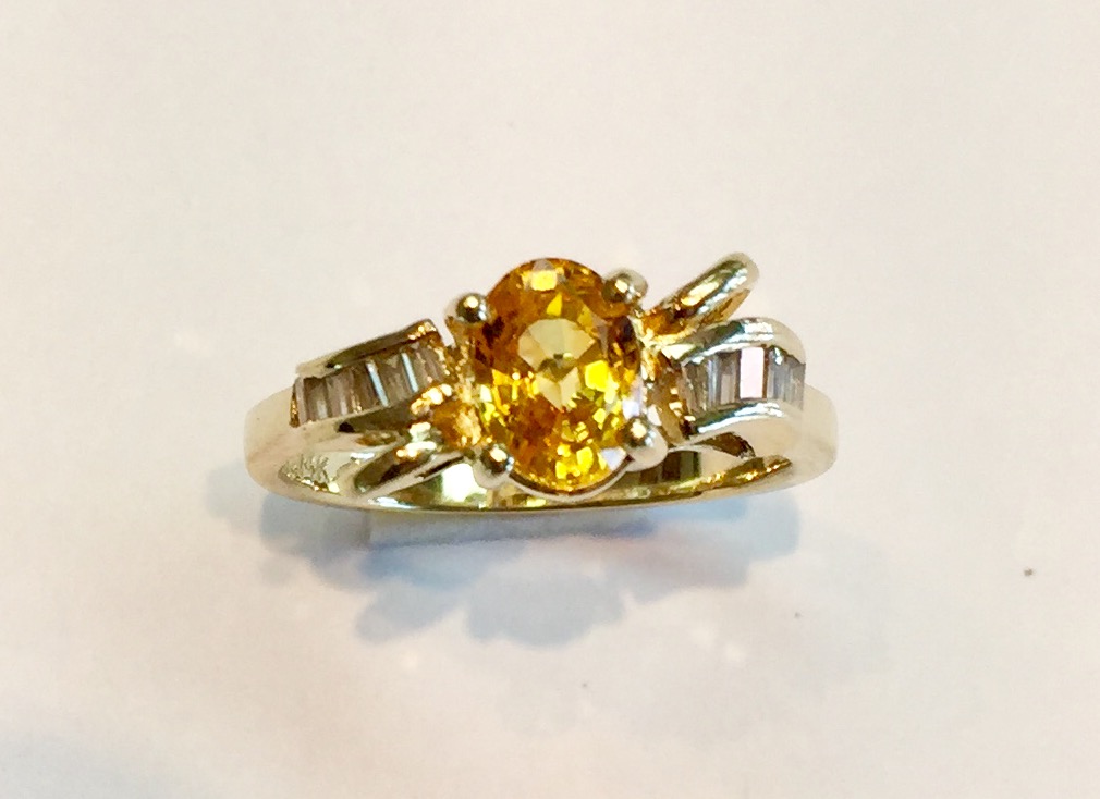 Item No AB42 $475 14k Yellow Gold Yellow Sapphire Diamond Ring 1 carat sapphire with diamond baquette accents. A ring with a sunny disposition. 