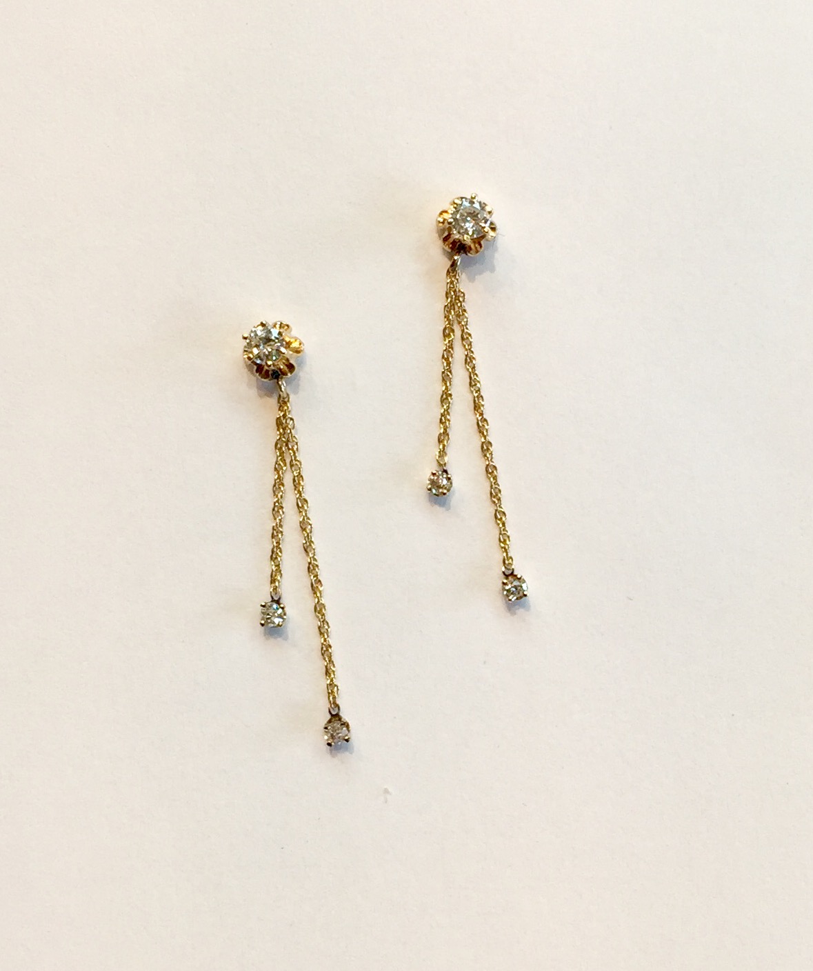 Item No AB46 USD395 14k Yellow Gold Diamond Dangle Earrings Two bright sparkling diamonds with flower cup settings and four small diamonds dangling from the studs. Charming ! 